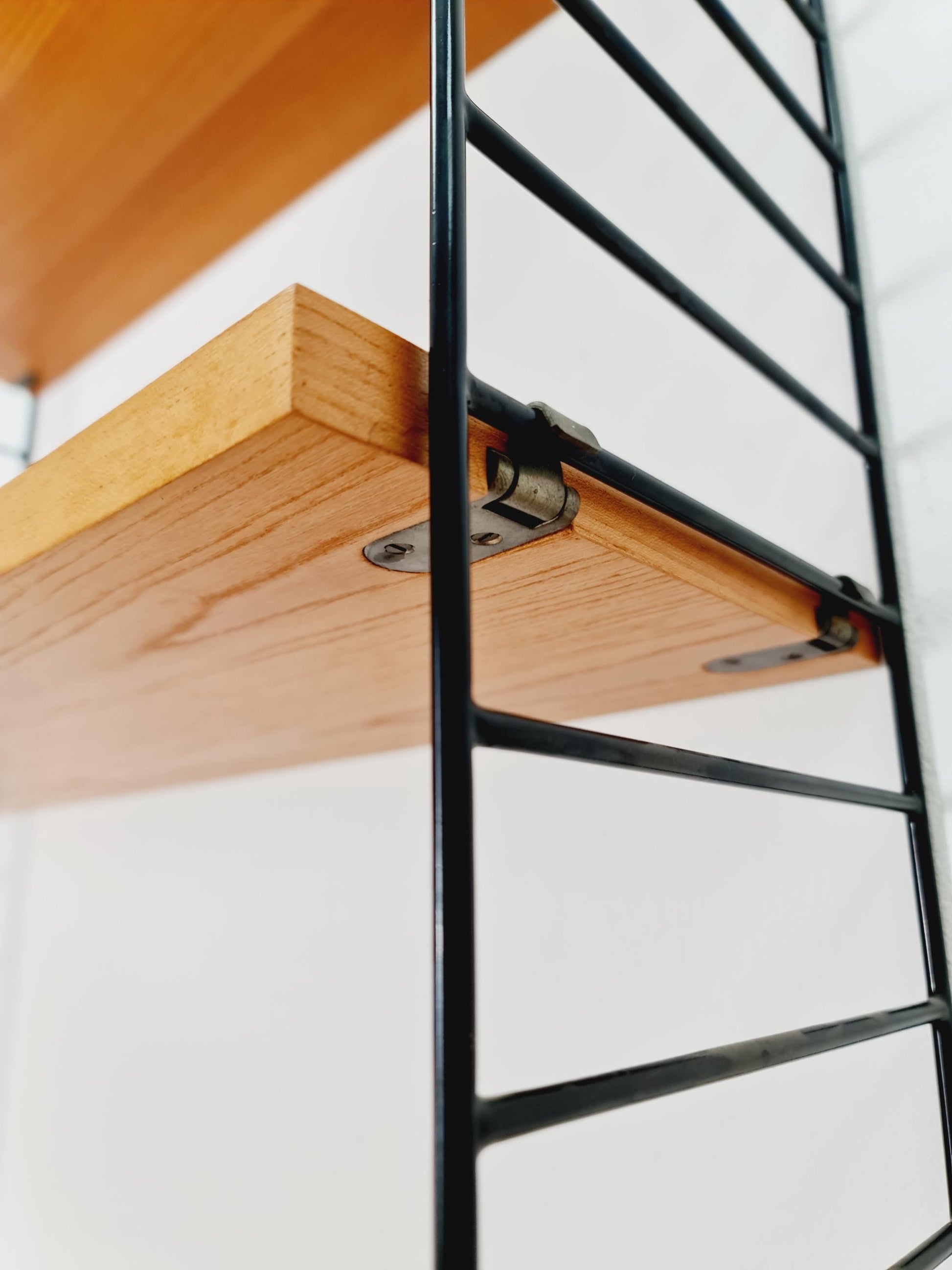 Original MCM Teak shelving system - consists of Black lacquered metal ladders, from string Stockholm 1960s
