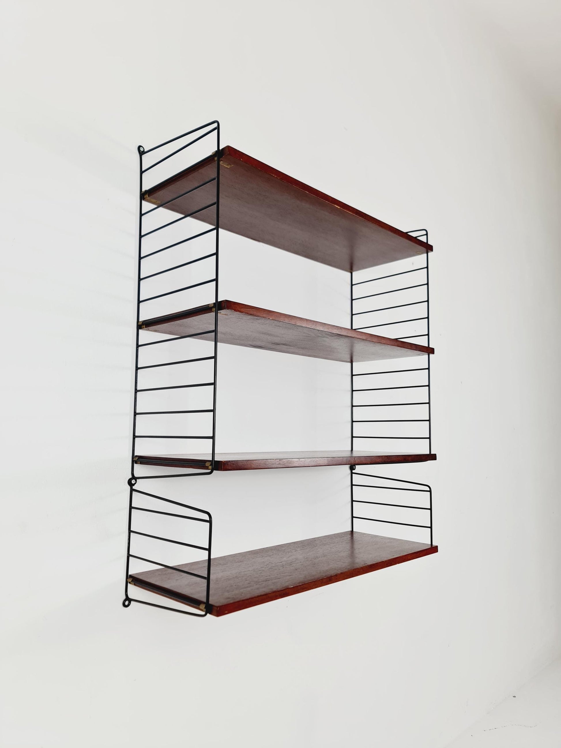 Original MCM Teak shelving system - consists of black lacquered metal ladders, from string Stockholm 1960s