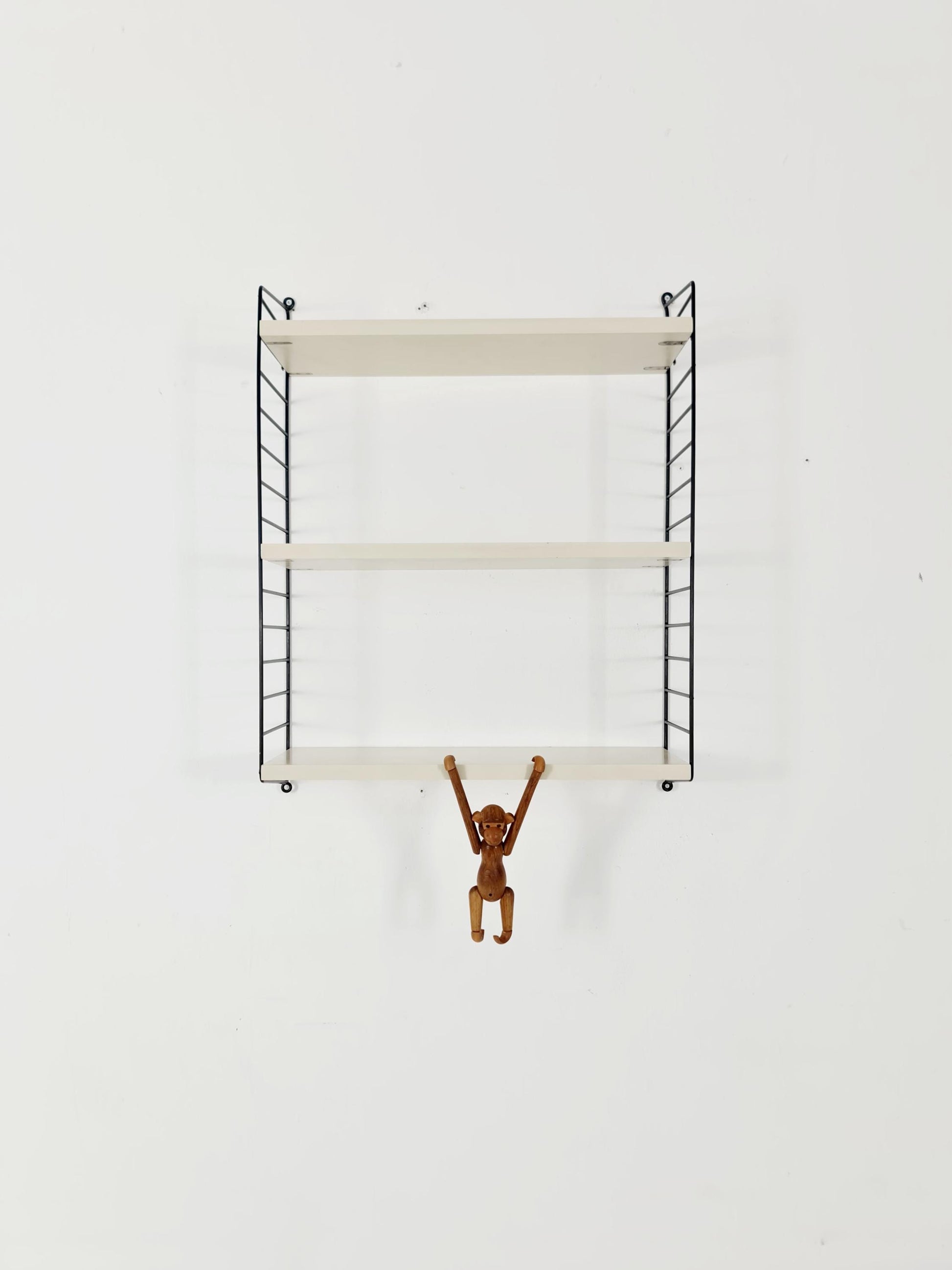 Original MCM wood shelving system - consists of black lacquered metal ladders, from string Stockholm 1960s