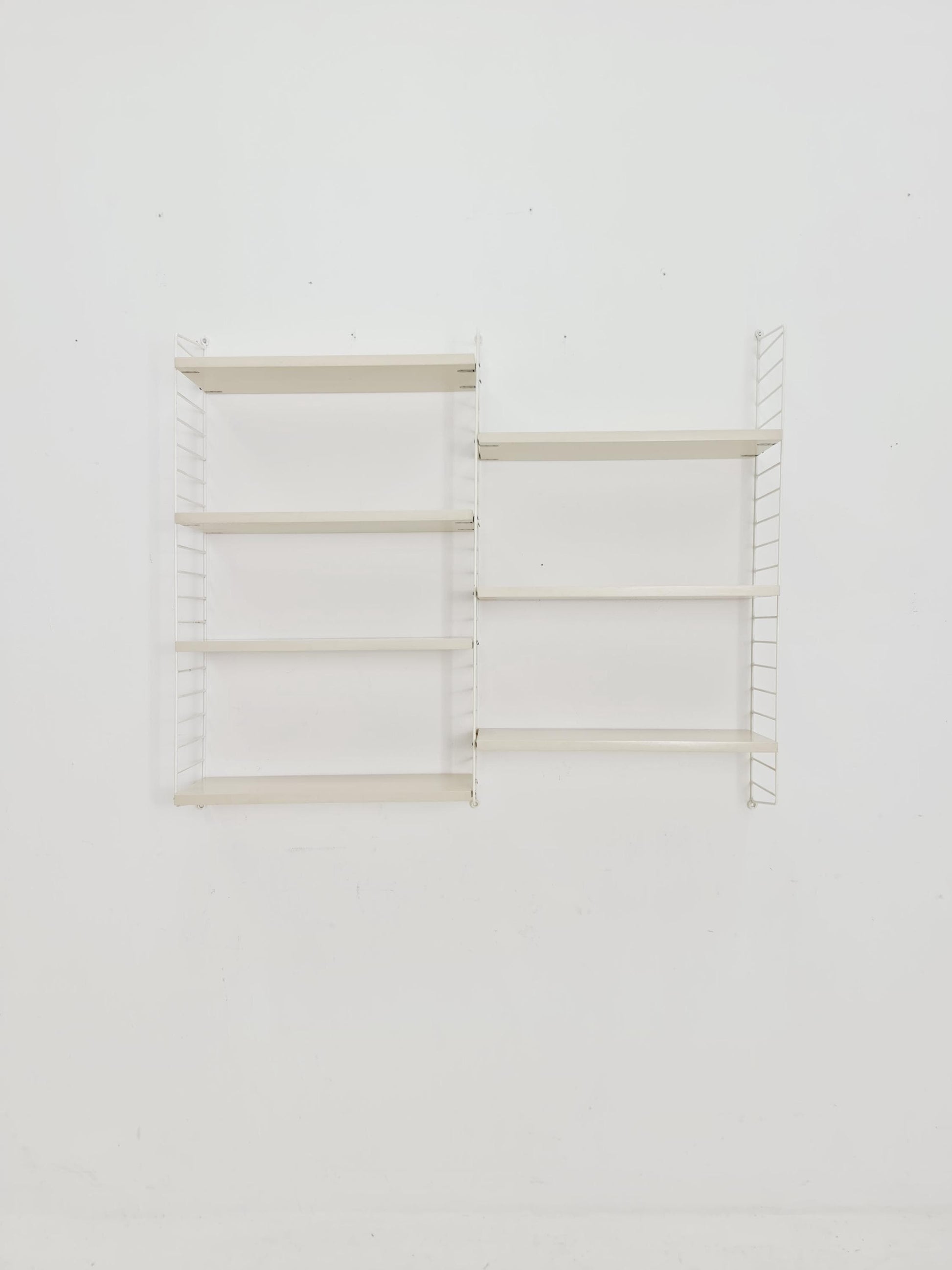 Original MCM wood shelving system - consists of black lacquered metal ladders, from string Stockholm 1960s