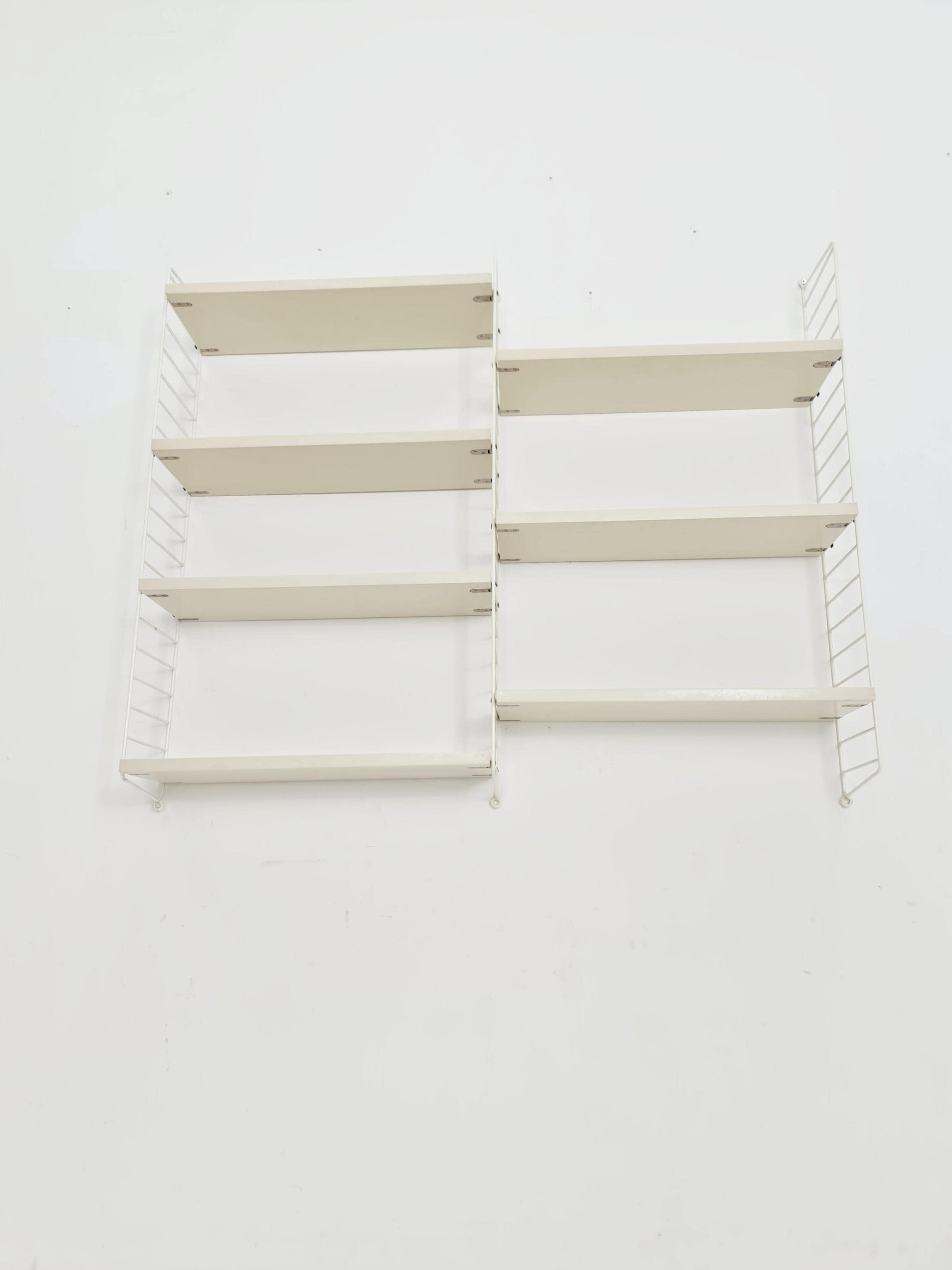 Original MCM wood shelving system - consists of black lacquered metal ladders, from string Stockholm 1960s