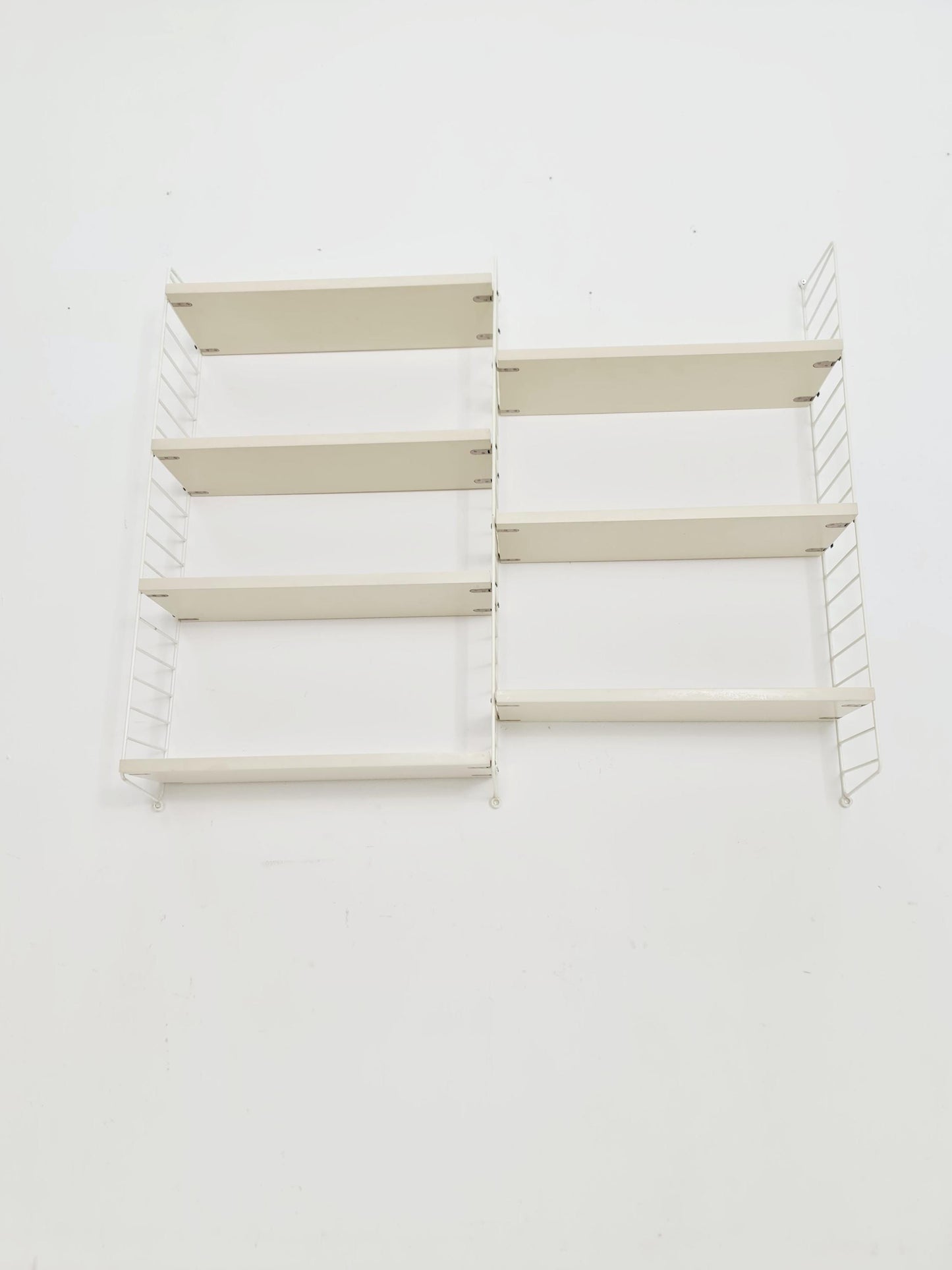 Original MCM wood shelving system - consists of black lacquered metal ladders, from string Stockholm 1960s