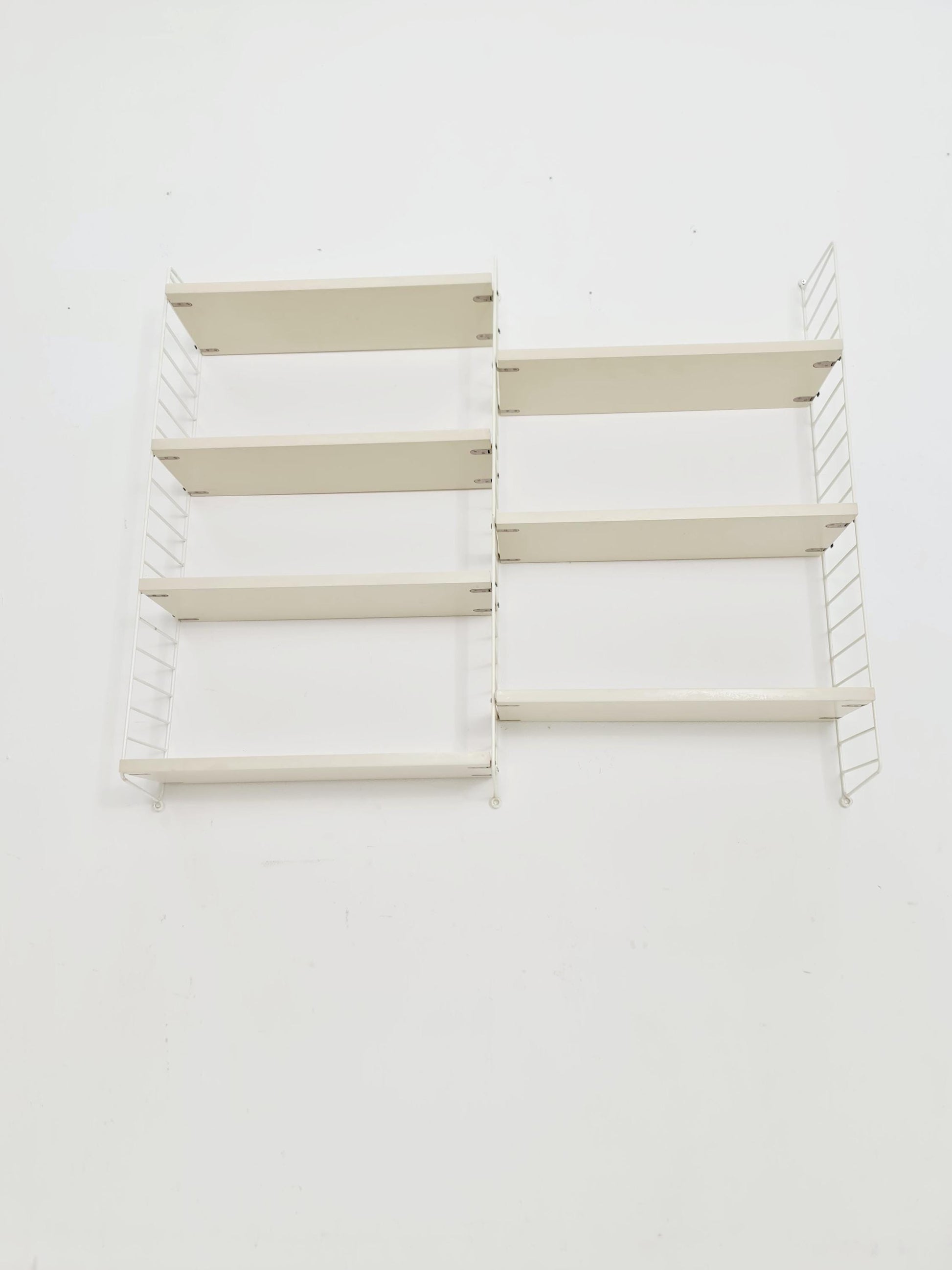 Original MCM wood shelving system - consists of black lacquered metal ladders, from string Stockholm 1960s