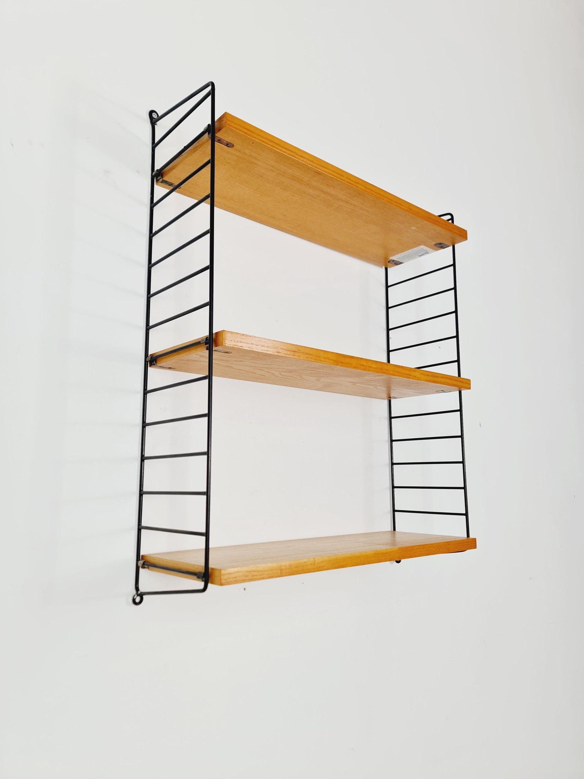 Original MCM Ash shelving system - consists of Black lacquered metal ladders, from string Stockholm 1960s