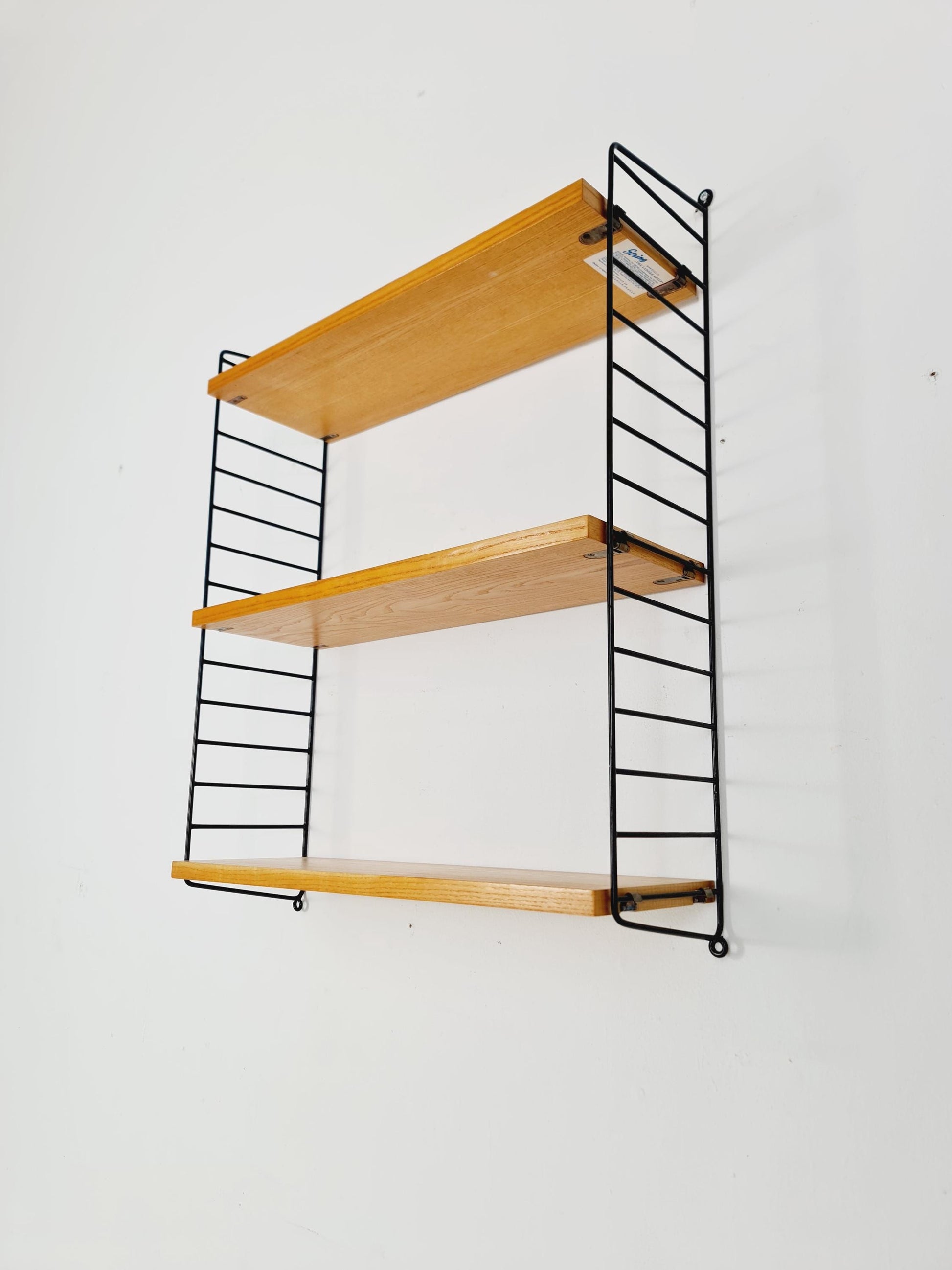 Original MCM Ash shelving system - consists of Black lacquered metal ladders, from string Stockholm 1960s