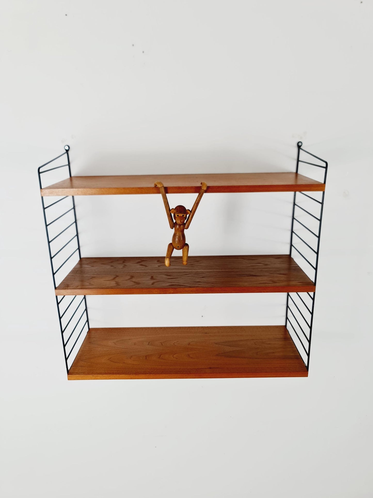 Original MCM Teak shelving system - consists of black lacquered metal ladders, from string Stockholm 1960s
