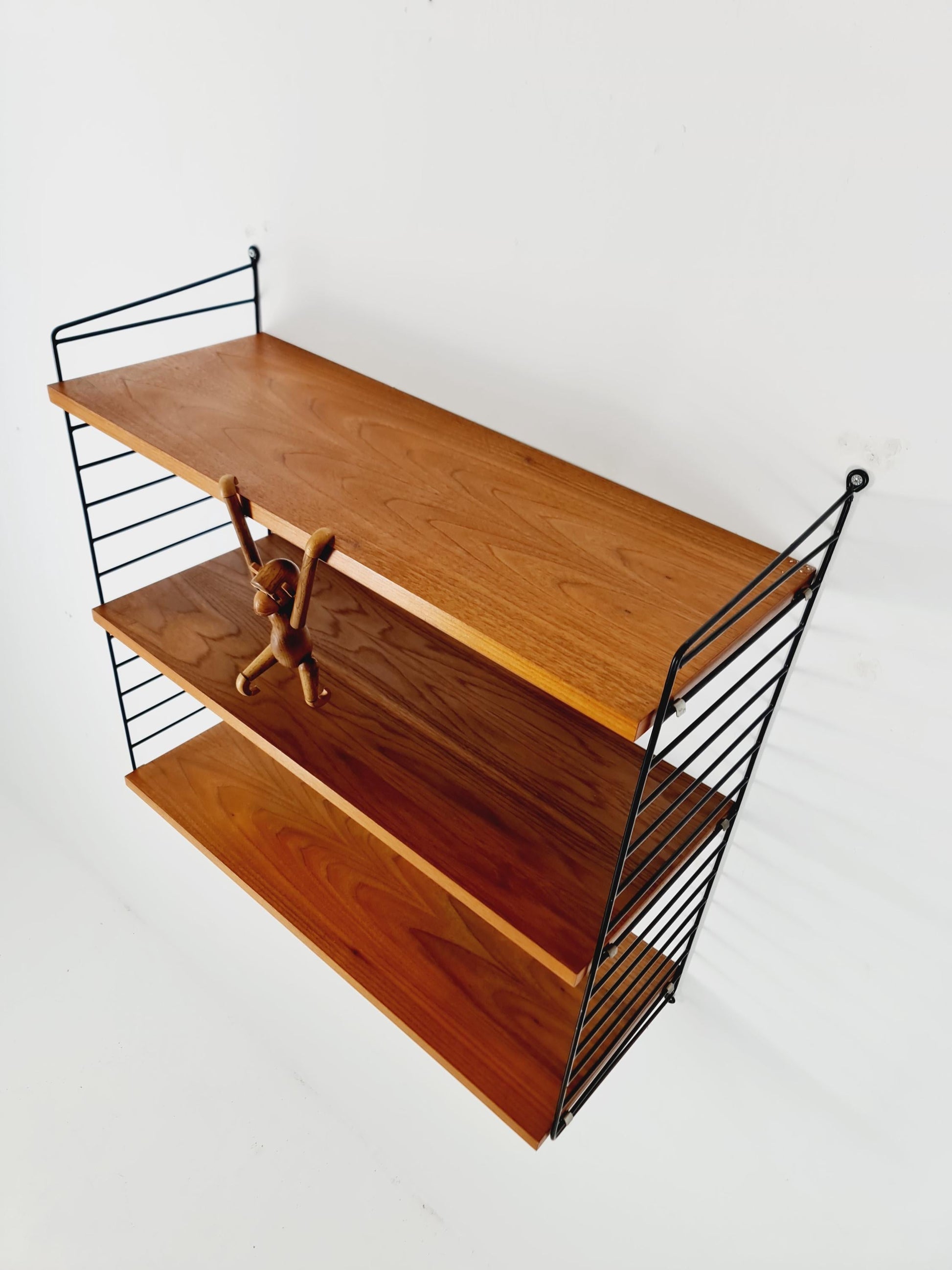 Original MCM Teak shelving system - consists of black lacquered metal ladders, from string Stockholm 1960s