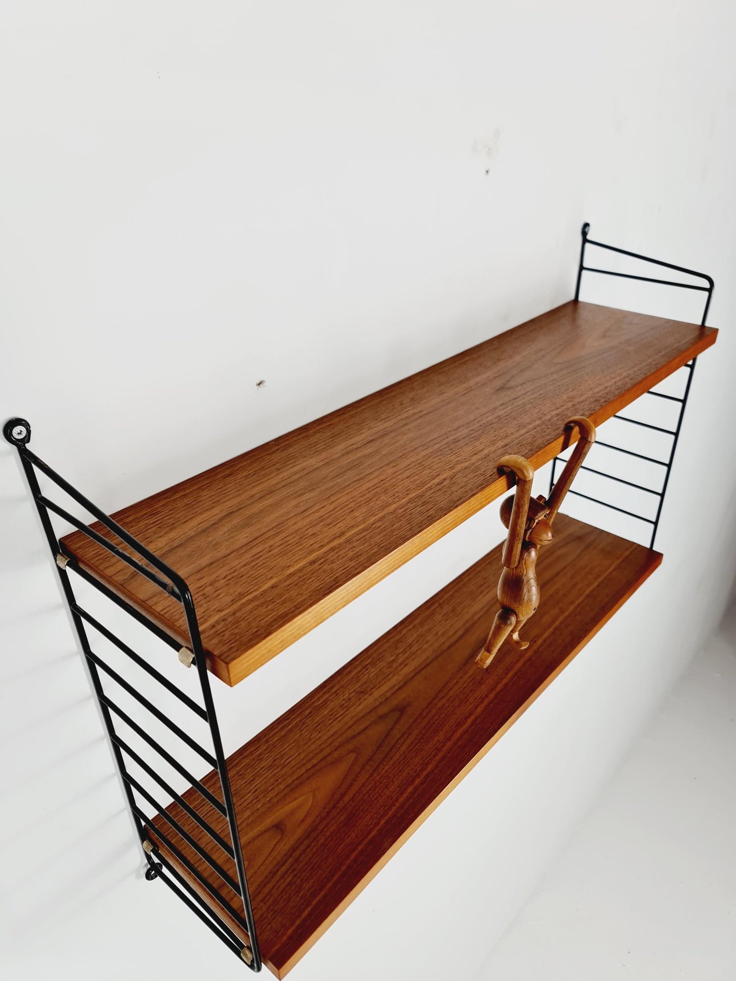 Original MCM Teak shelving system - consists of black lacquered metal ladders, from string Stockholm 1960s