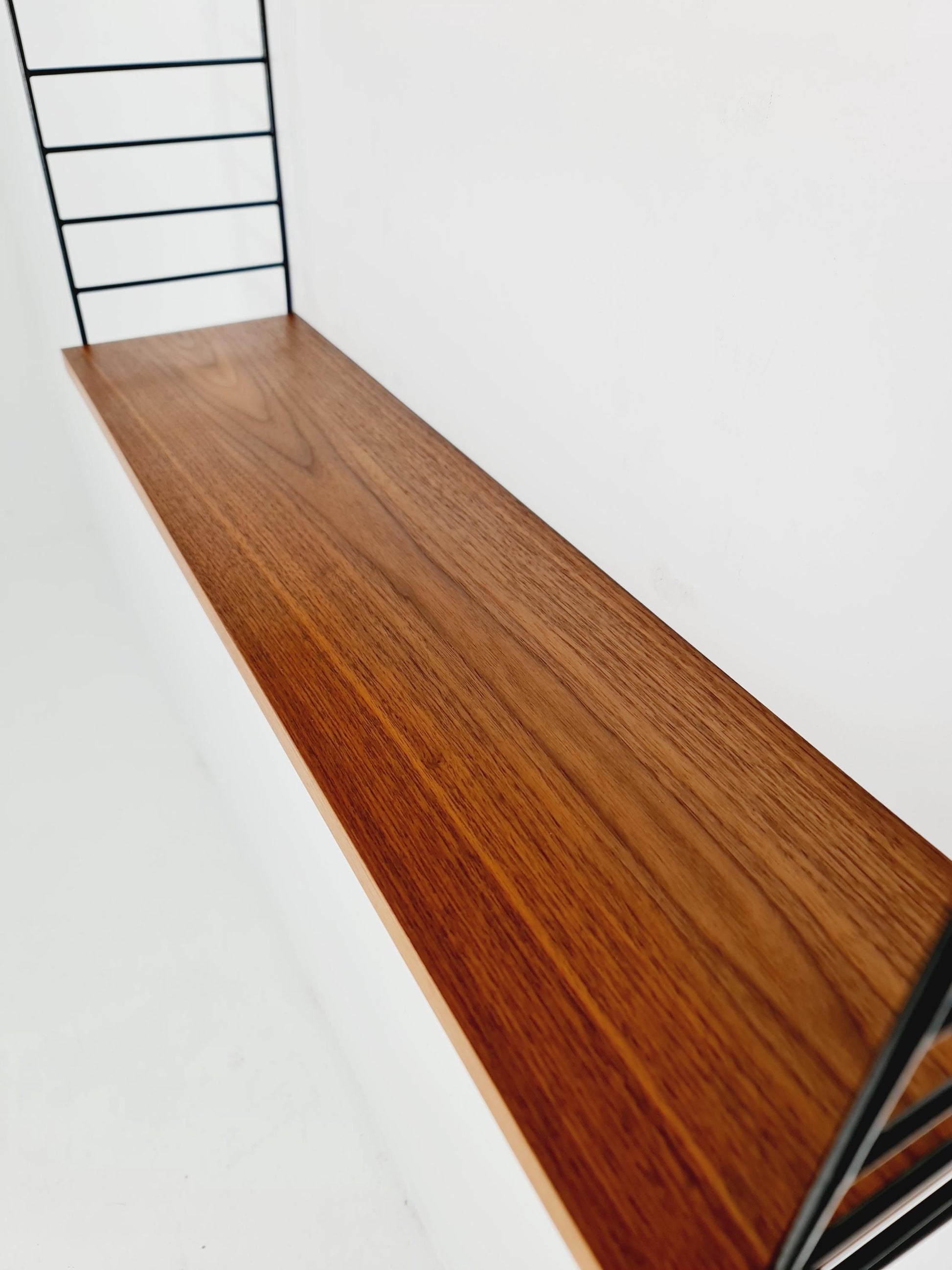 Original MCM Teak shelving system - consists of black lacquered metal ladders, from string Stockholm 1960s