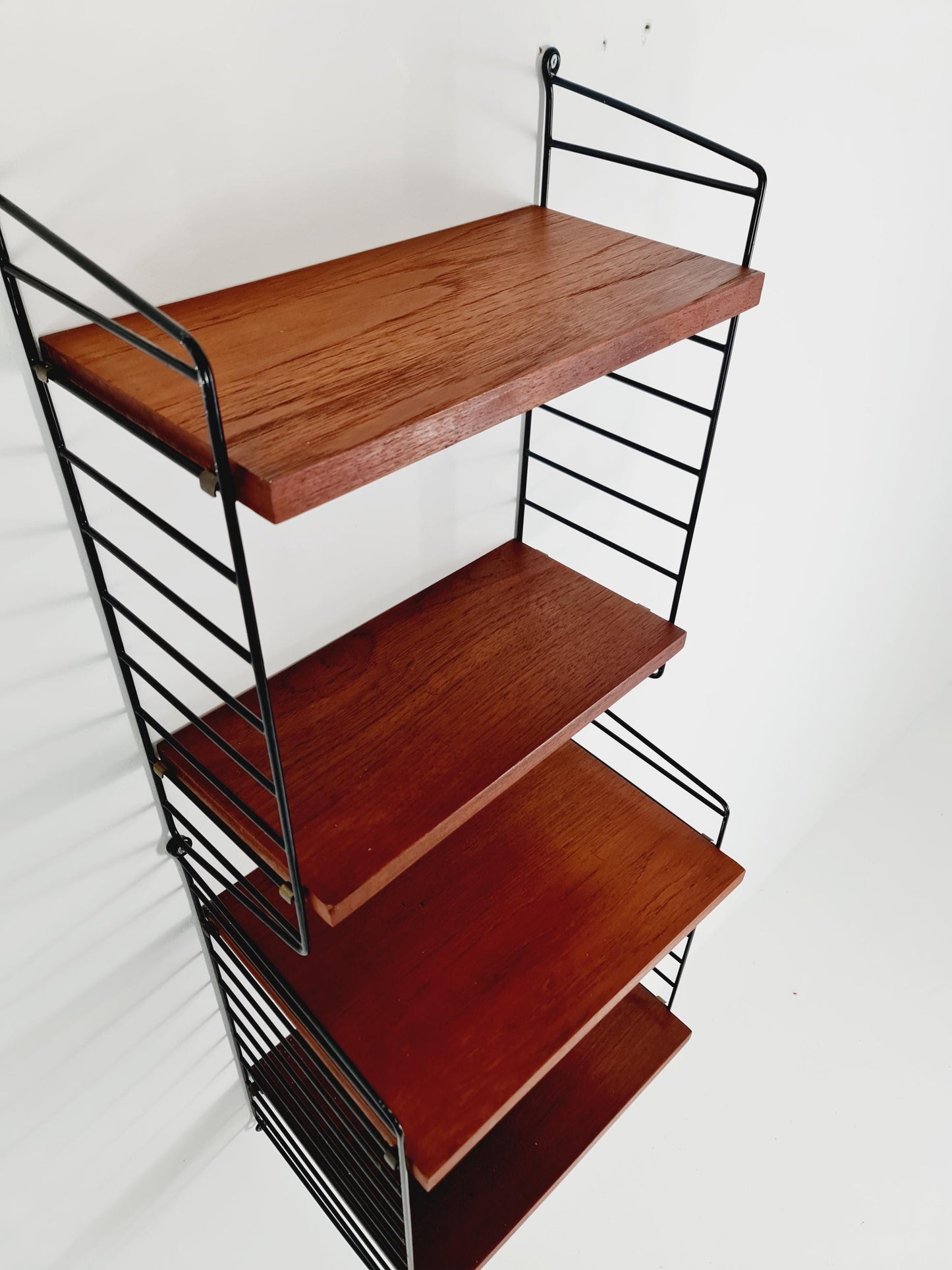 Original MCM Teak shelving system - consists of Black lacquered metal ladders, from string Stockholm 1960s