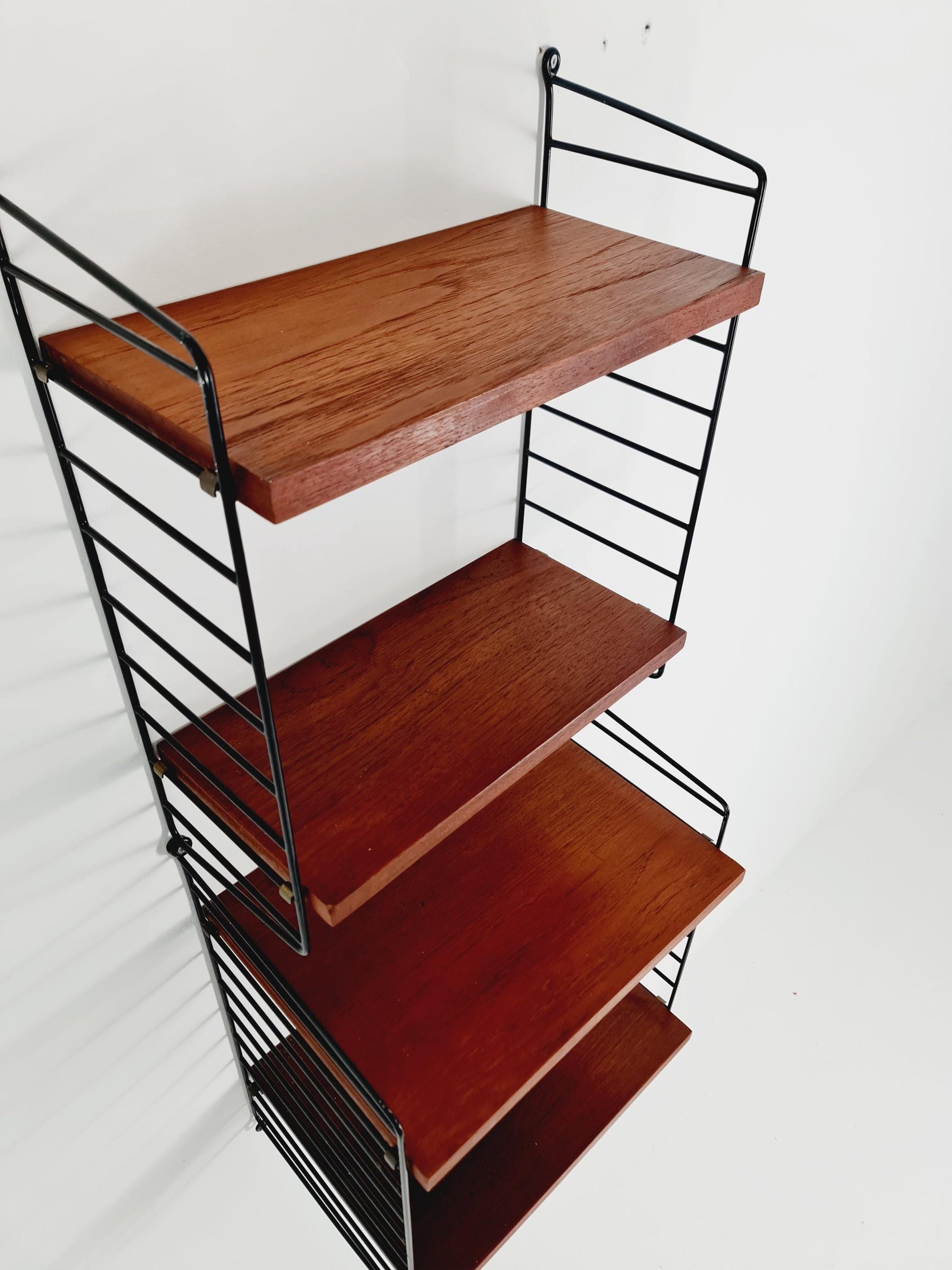Original MCM Teak shelving system - consists of Black lacquered metal ladders, from string Stockholm 1960s