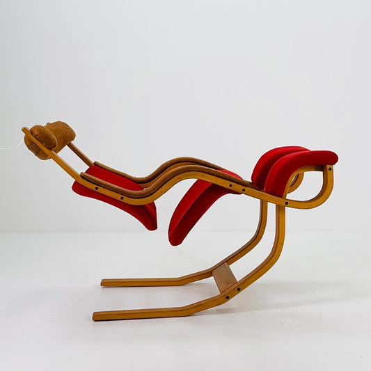 Mid century Red fabric - leather Gravity” rocking Lounge chair by Peter Opsvik for Stokke, 1980s