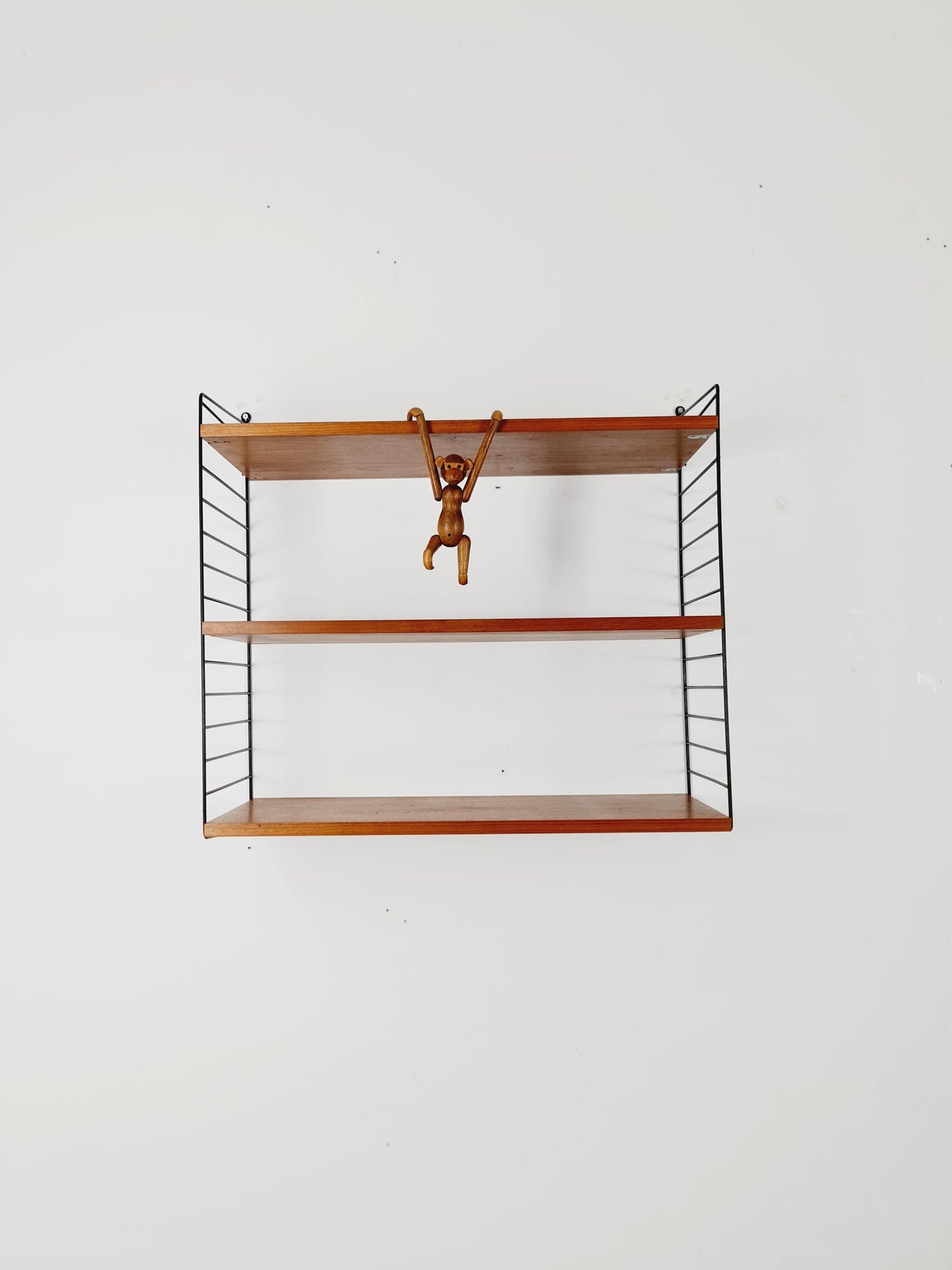 Original MCM Teak shelving system - consists of black lacquered metal ladders, from string Stockholm 1960s