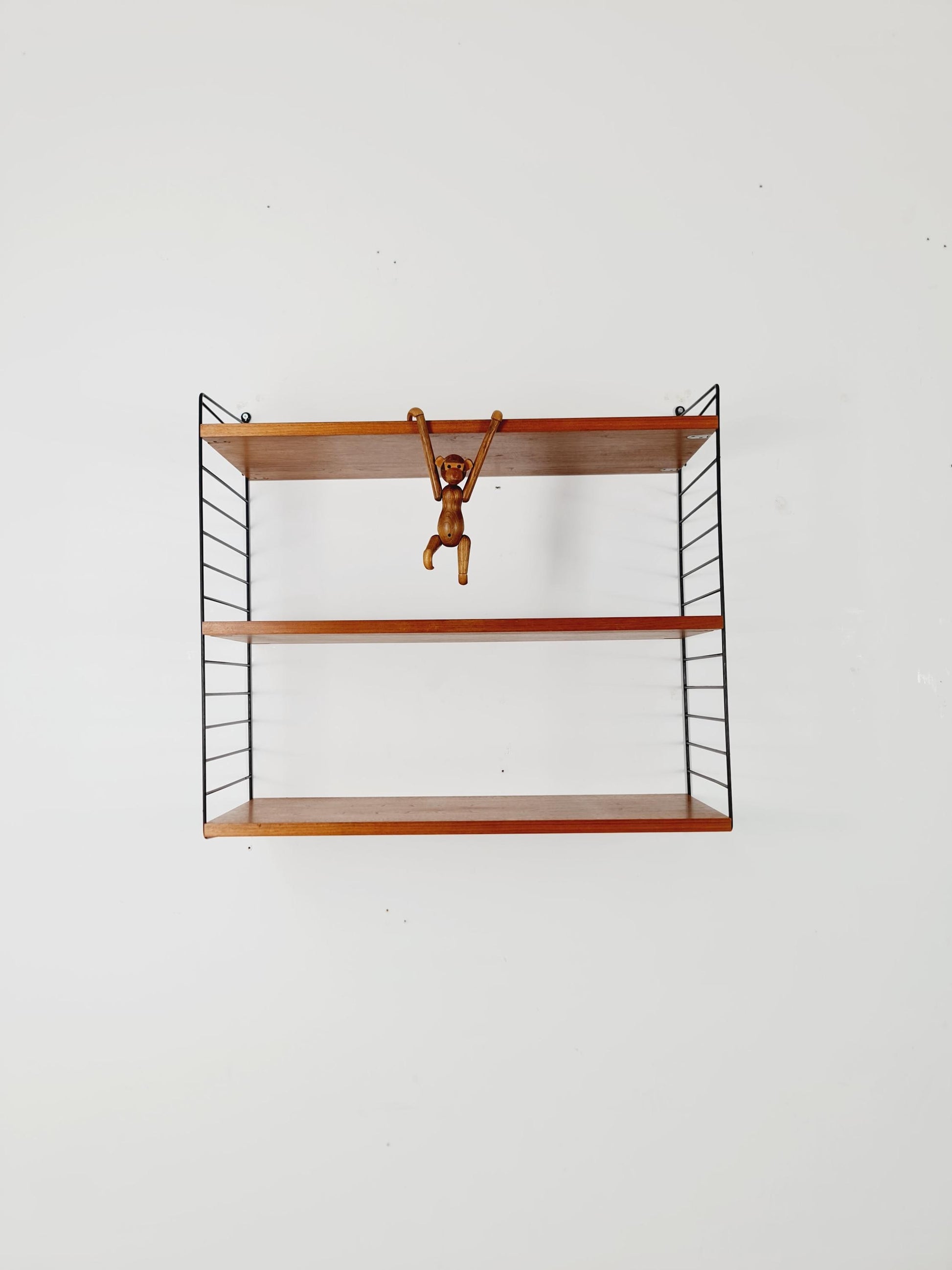 Original MCM Teak shelving system - consists of black lacquered metal ladders, from string Stockholm 1960s