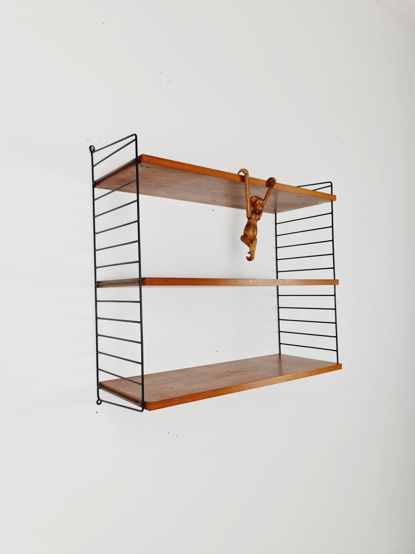 Original MCM Teak shelving system - consists of black lacquered metal ladders, from string Stockholm 1960s