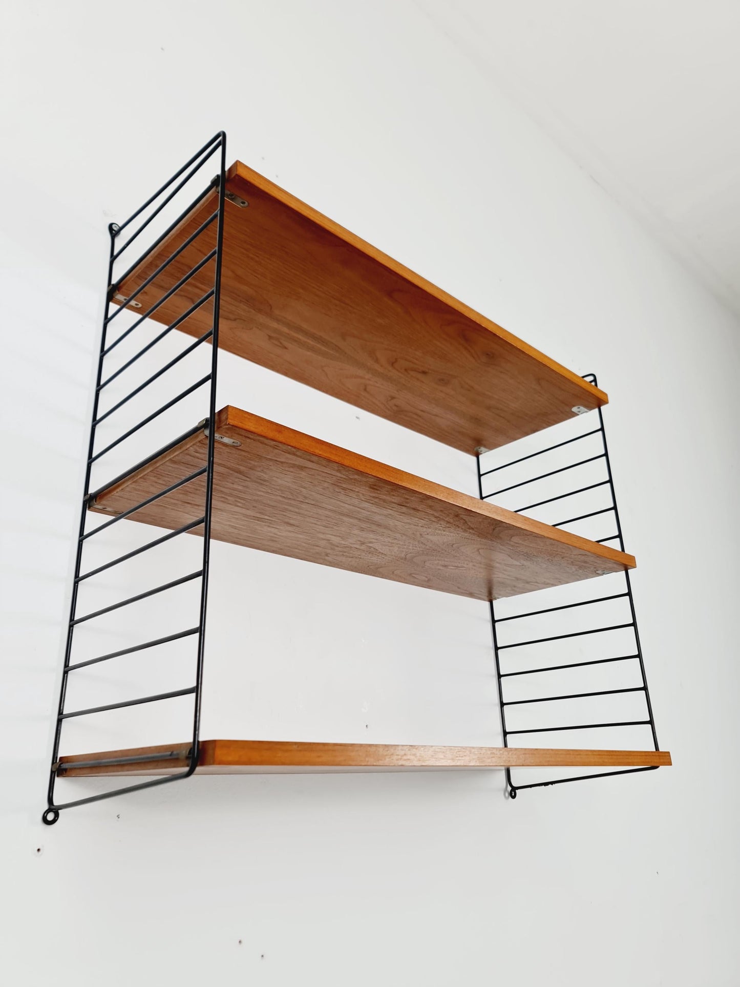 Original MCM Teak shelving system - consists of black lacquered metal ladders, from string Stockholm 1960s