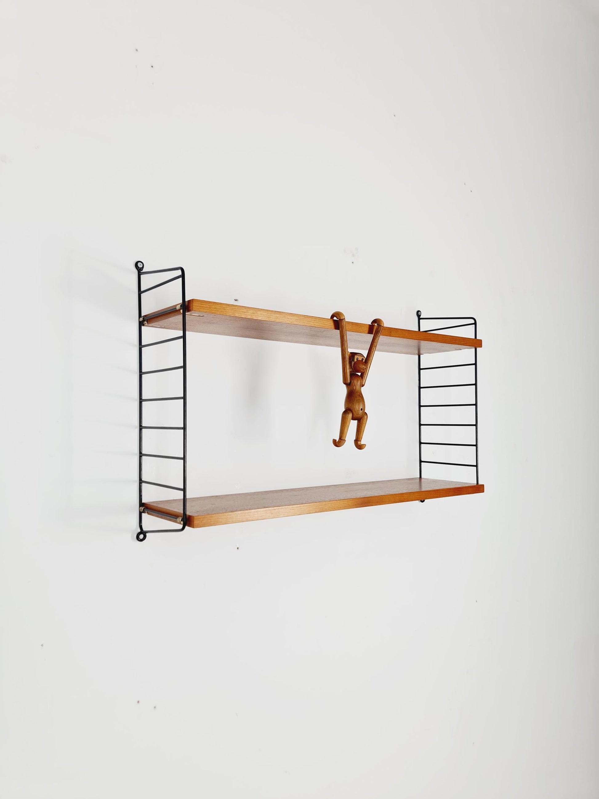 Original MCM Teak shelving system - consists of black lacquered metal ladders, from string Stockholm 1960s
