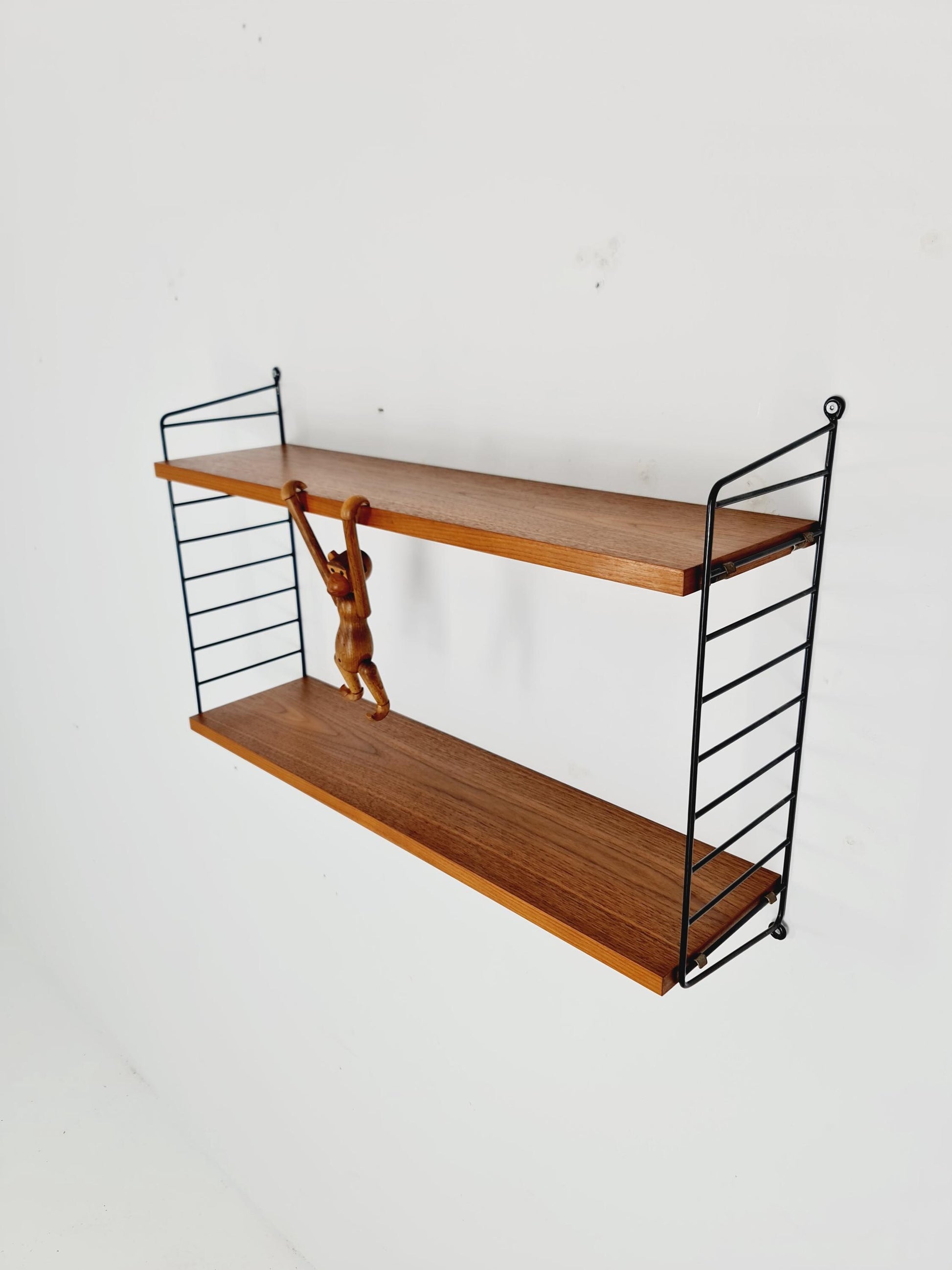 Original MCM Teak shelving system - consists of black lacquered metal ladders, from string Stockholm 1960s