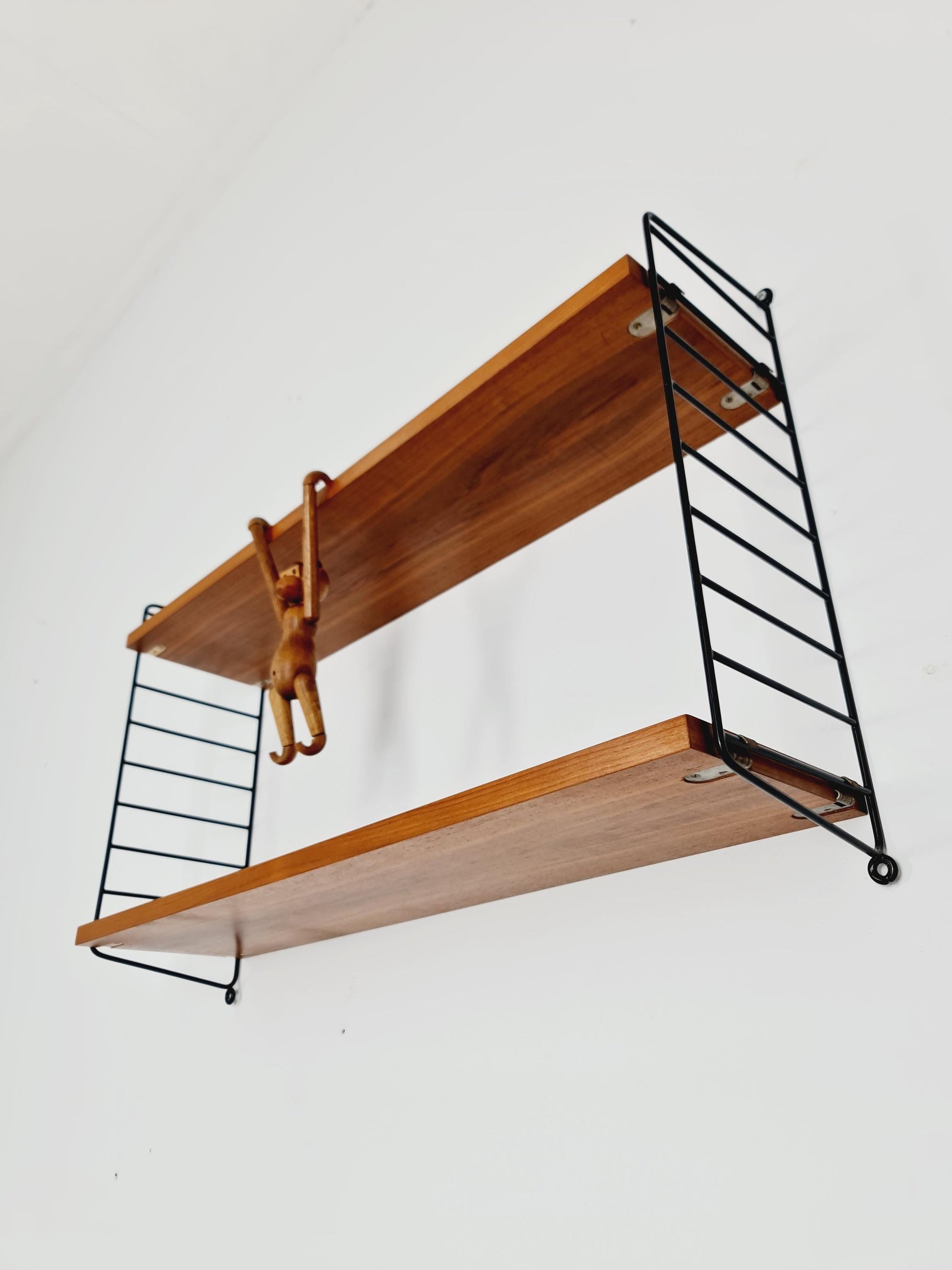 Original MCM Teak shelving system - consists of black lacquered metal ladders, from string Stockholm 1960s