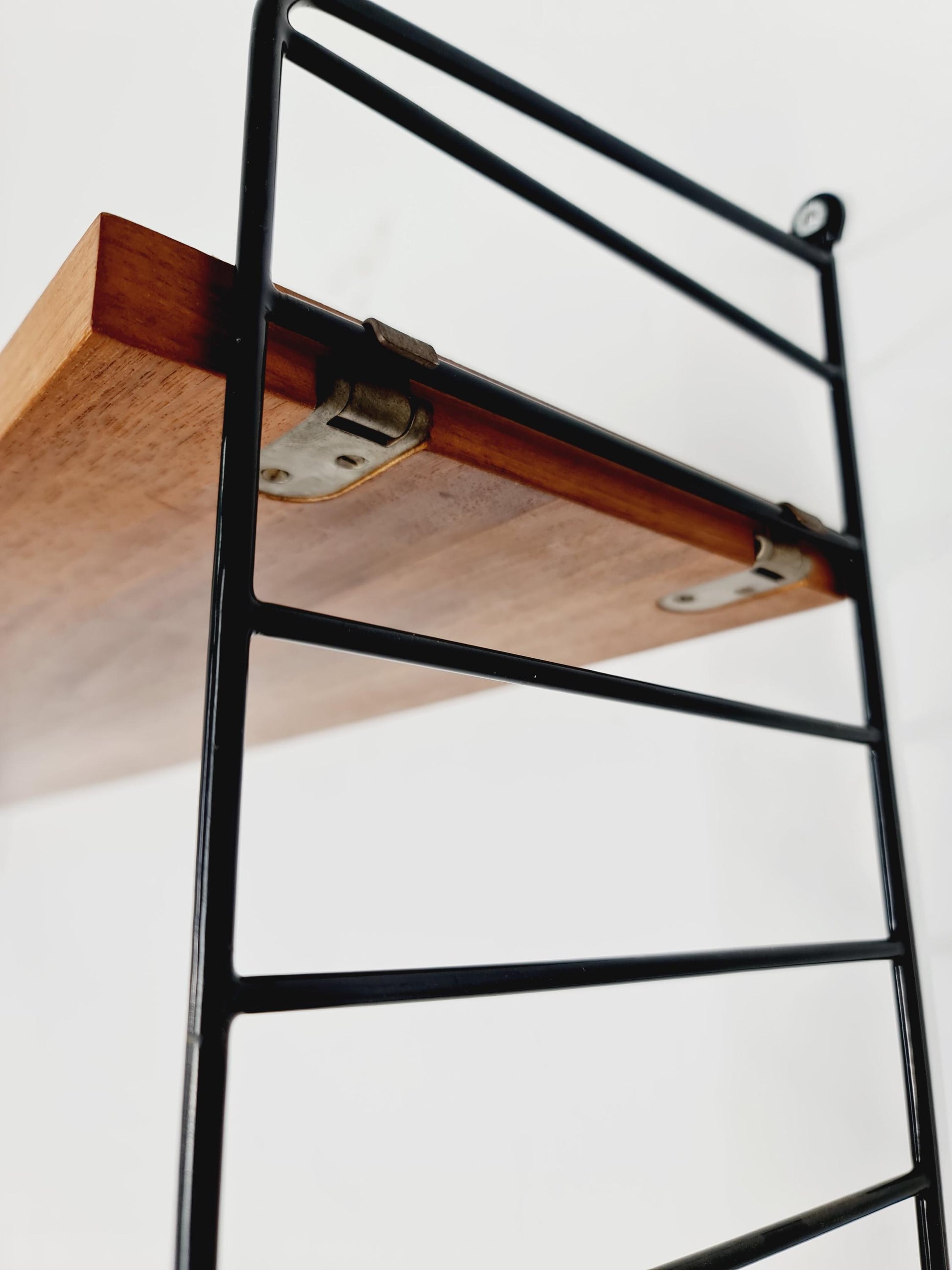 Original MCM Teak shelving system - consists of black lacquered metal ladders, from string Stockholm 1960s