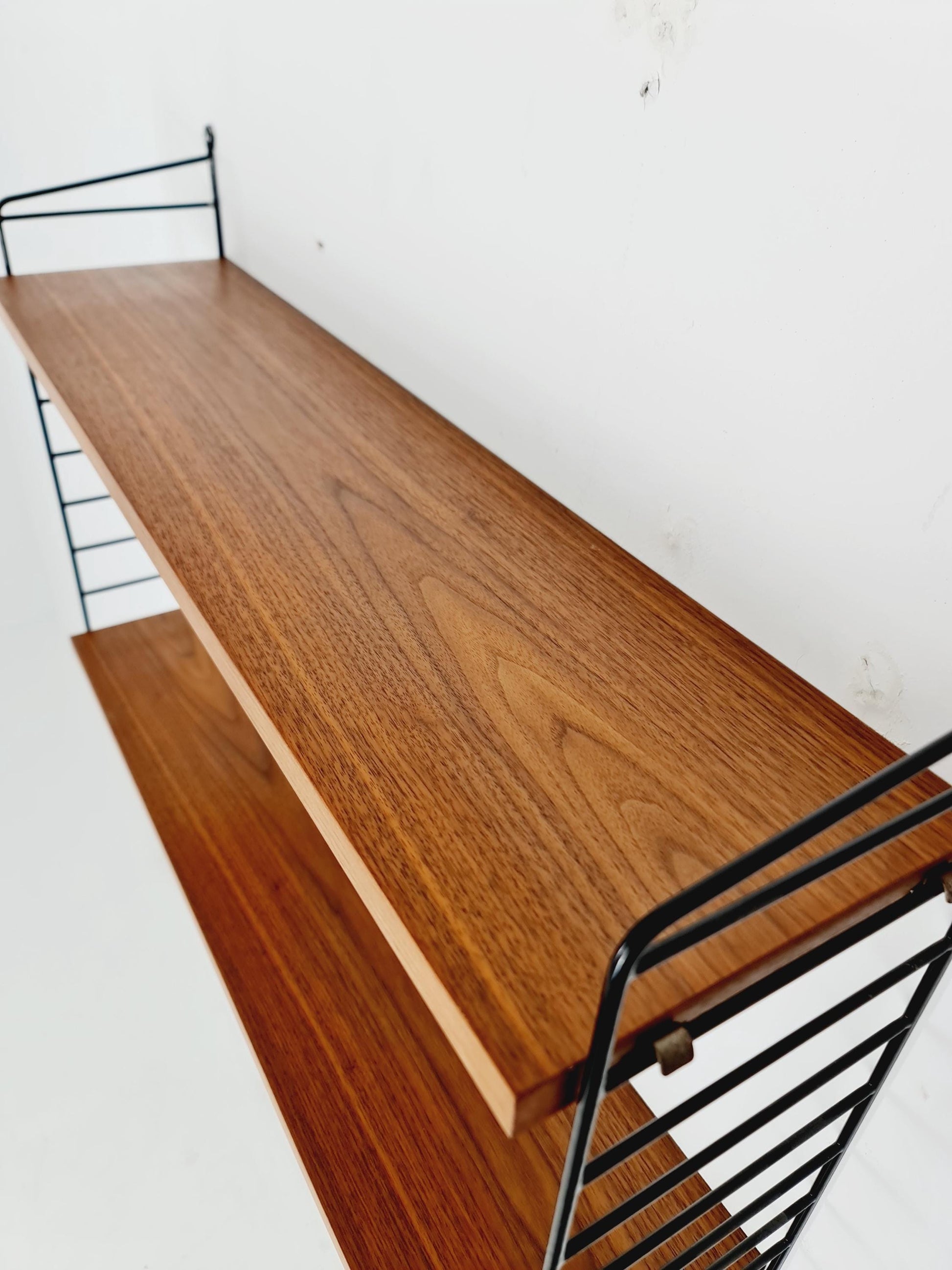 Original MCM Teak shelving system - consists of black lacquered metal ladders, from string Stockholm 1960s