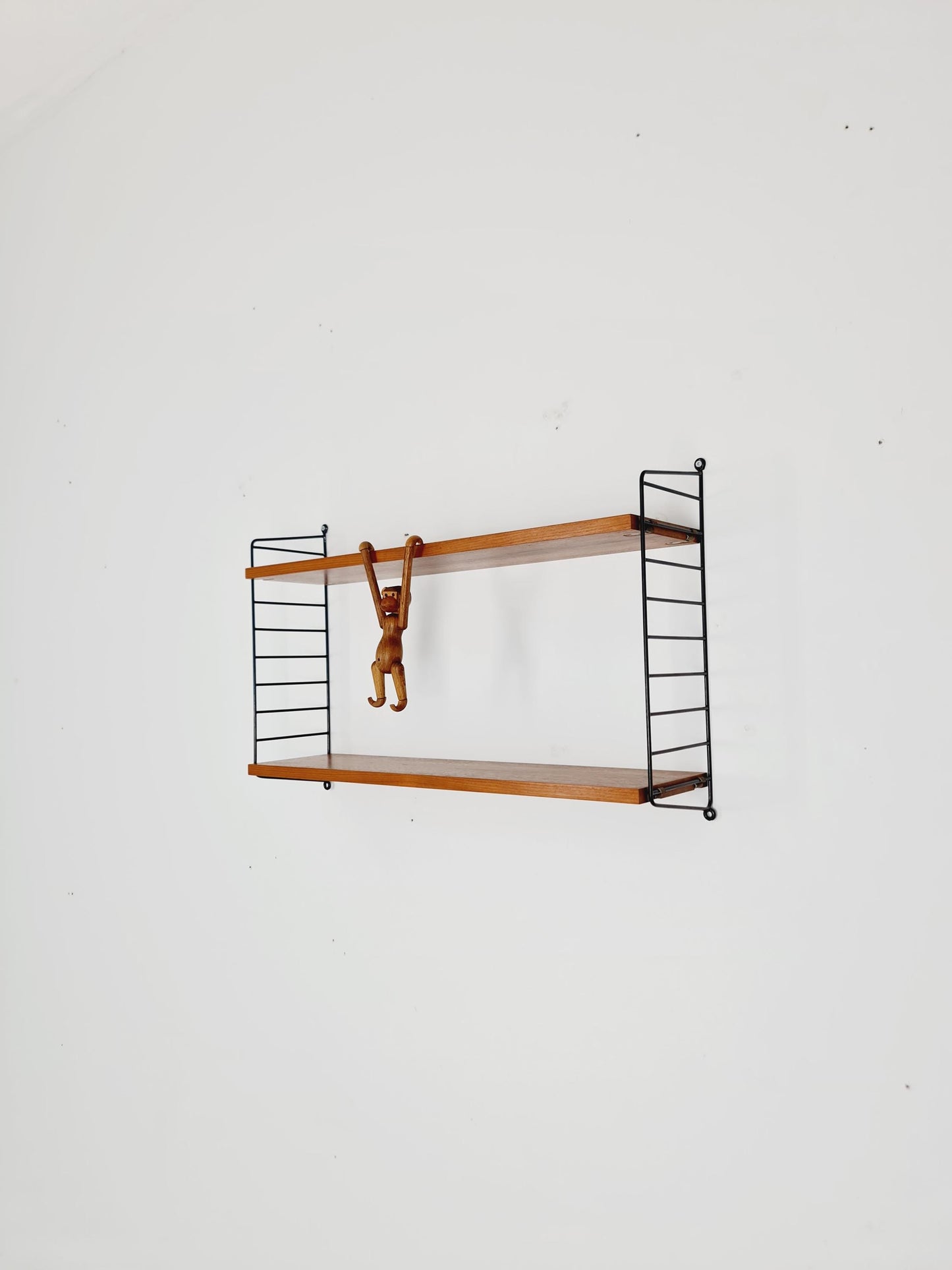 Original MCM Teak shelving system - consists of black lacquered metal ladders, from string Stockholm 1960s