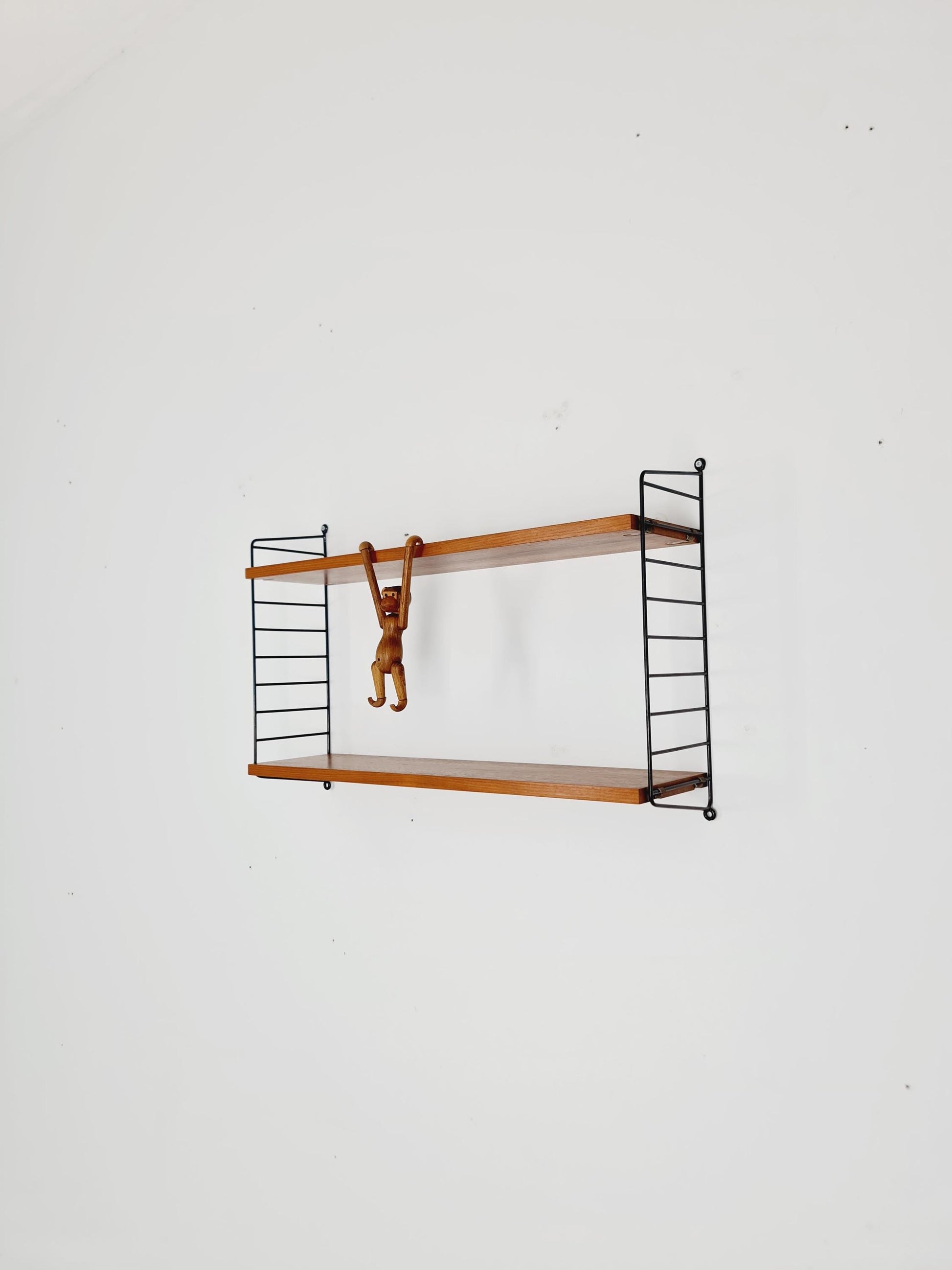 Original MCM Teak shelving system - consists of black lacquered metal ladders, from string Stockholm 1960s