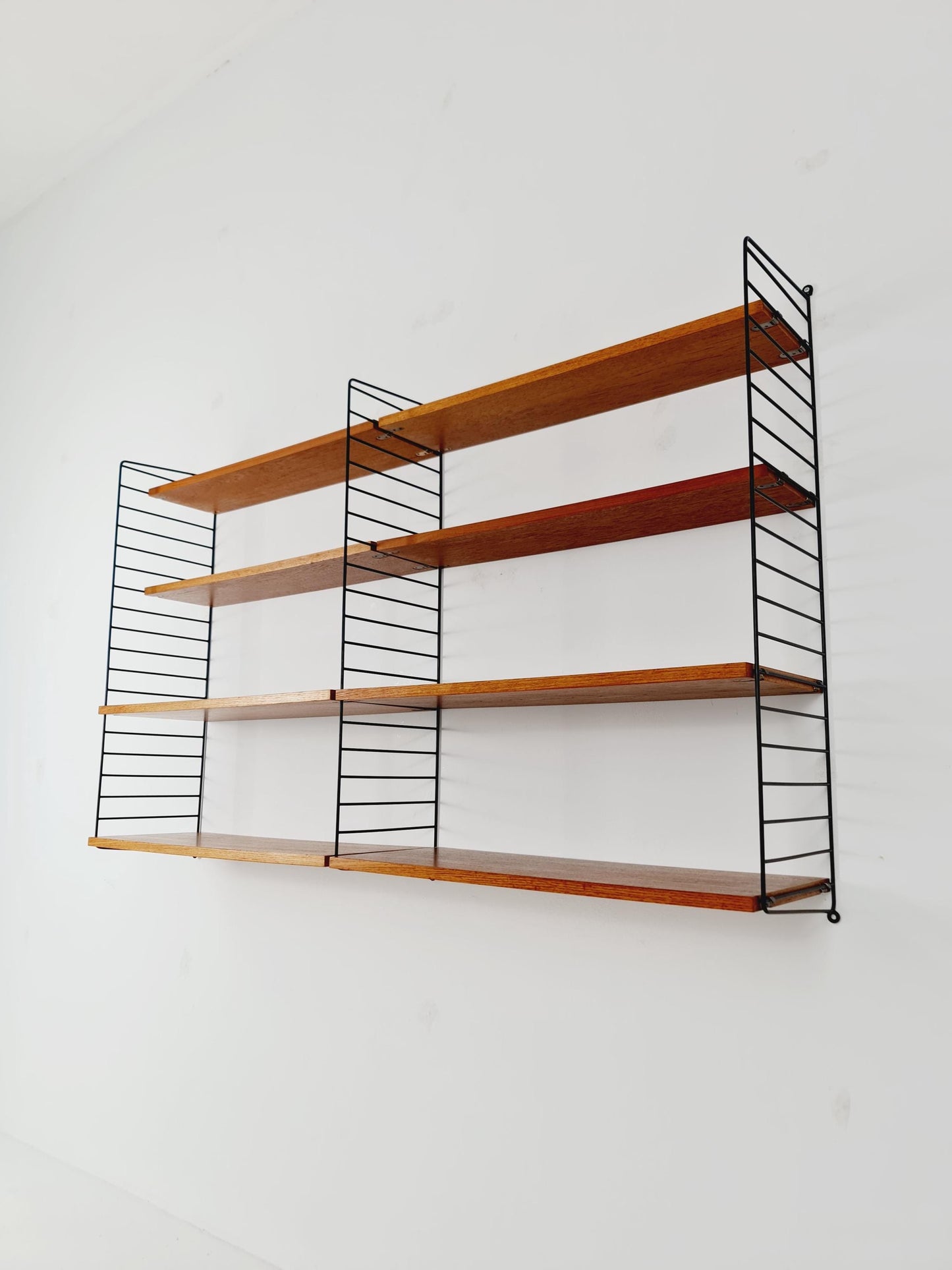 Original MCM Teak shelving system - consists of black lacquered metal ladders, from string Stockholm 1960s