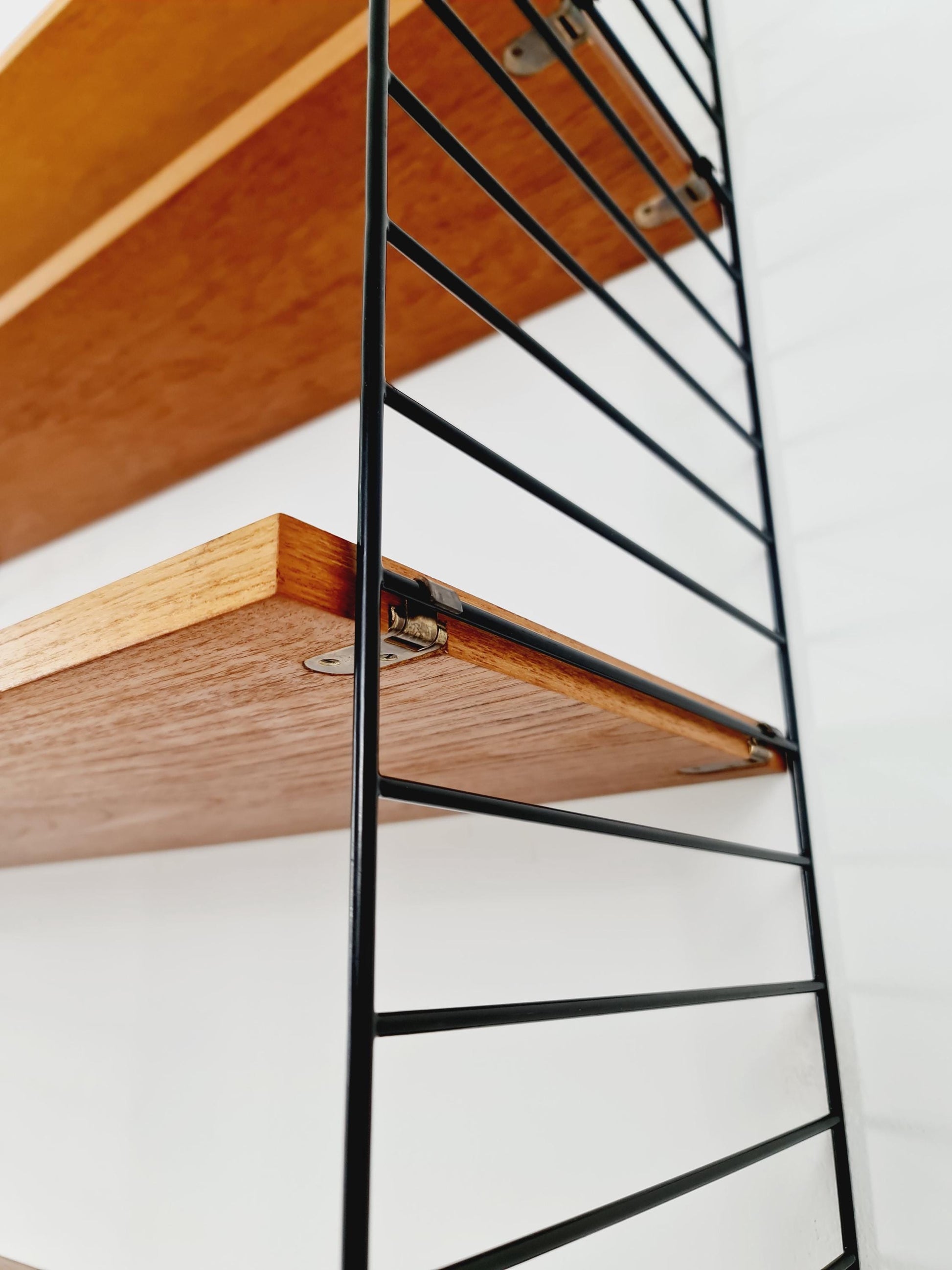 Original MCM Teak shelving system - consists of black lacquered metal ladders, from string Stockholm 1960s