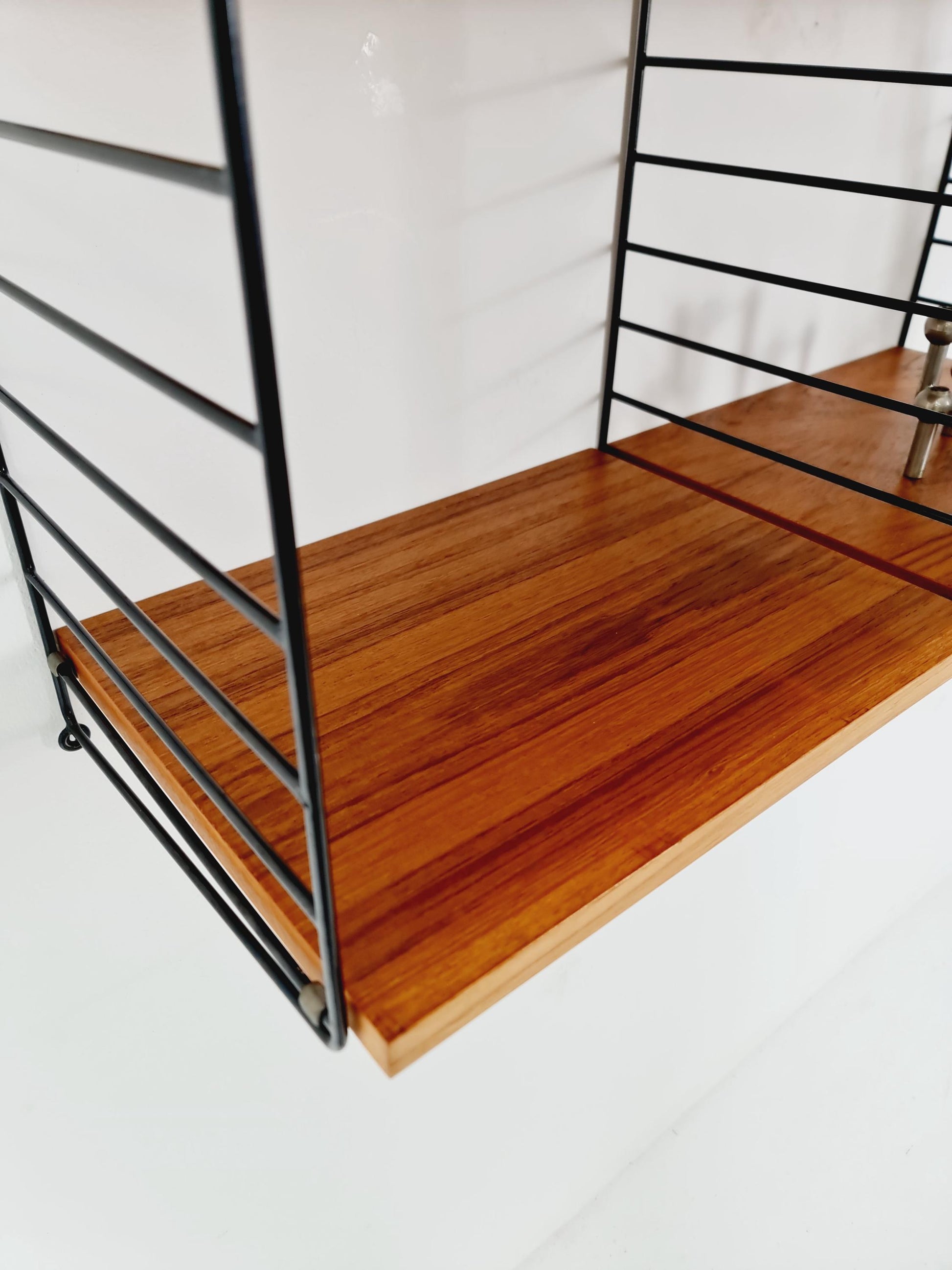 Original MCM Teak shelving system - consists of Black lacquered metal ladders, from string Stockholm 1960s