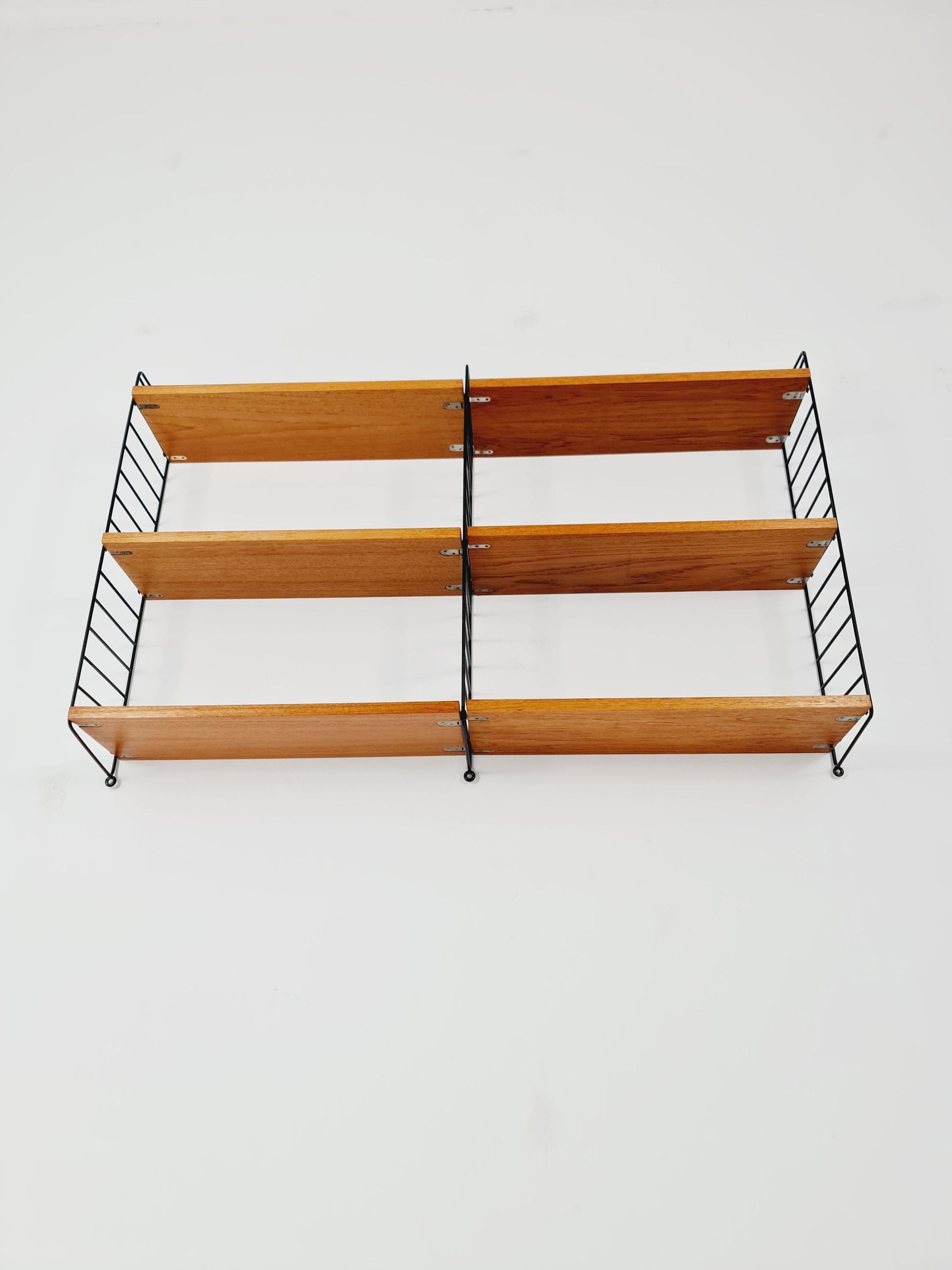 Original MCM Teak shelving system - consists of Black lacquered metal ladders, from string Stockholm 1960s