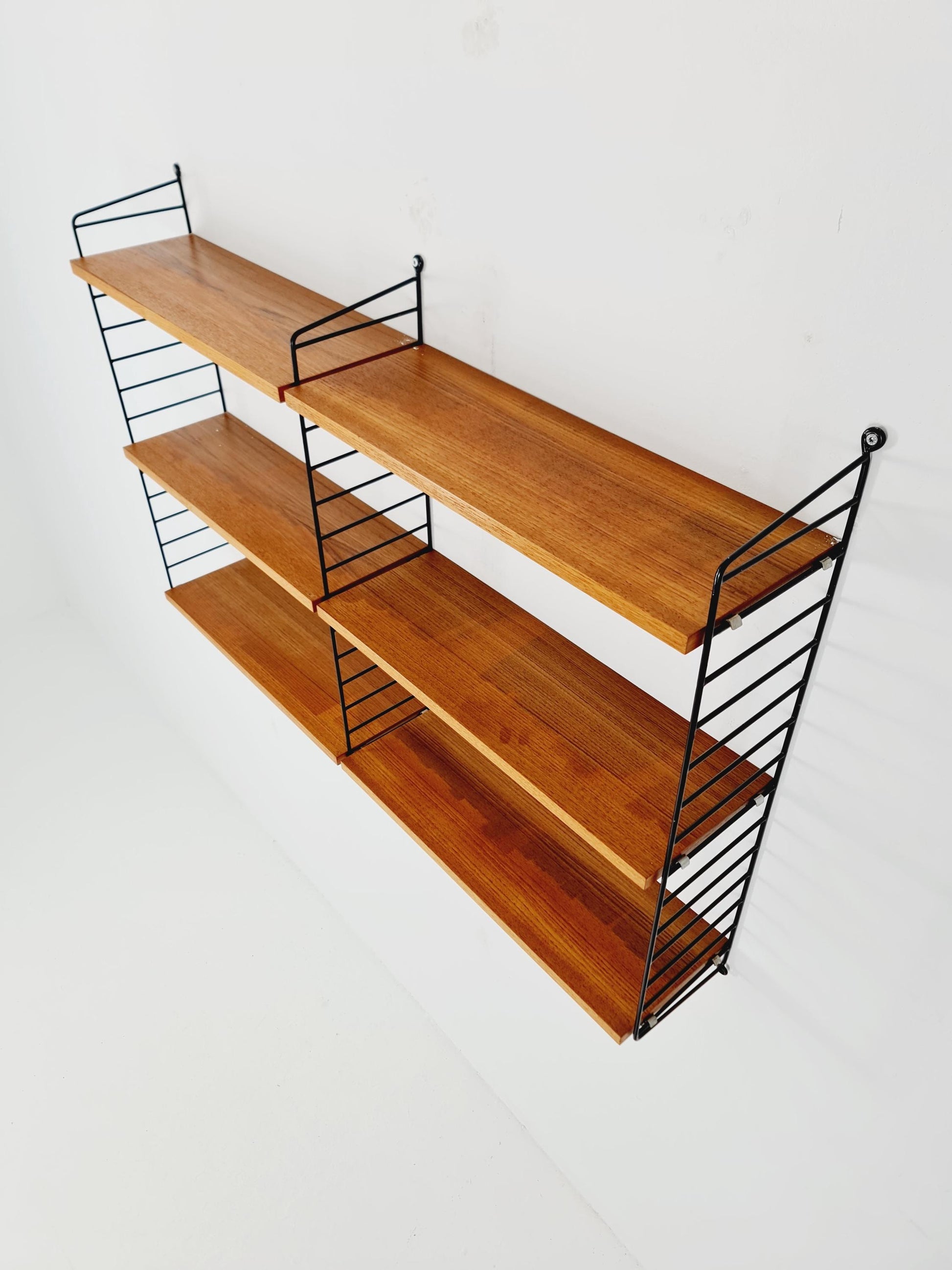 Original MCM Teak shelving system - consists of Black lacquered metal ladders, from string Stockholm 1960s