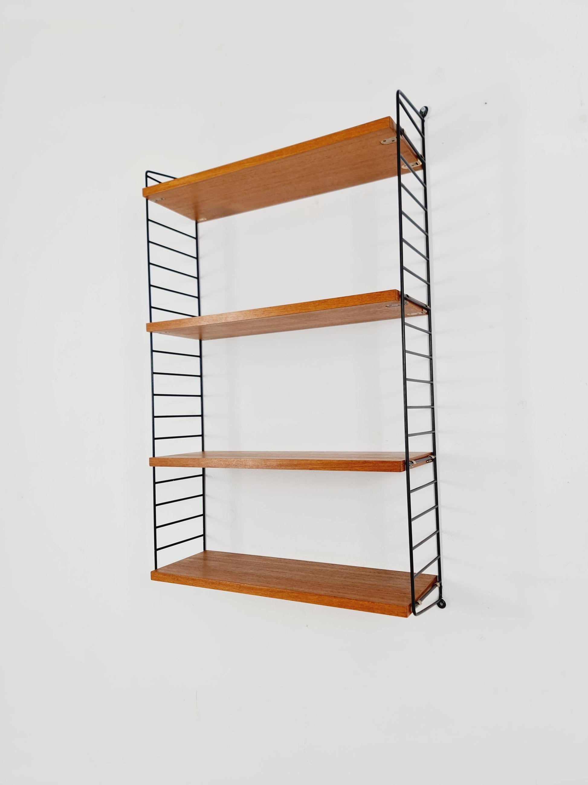 Original MCM Teak shelving system - consists of Black lacquered metal ladders, from string Stockholm 1960s