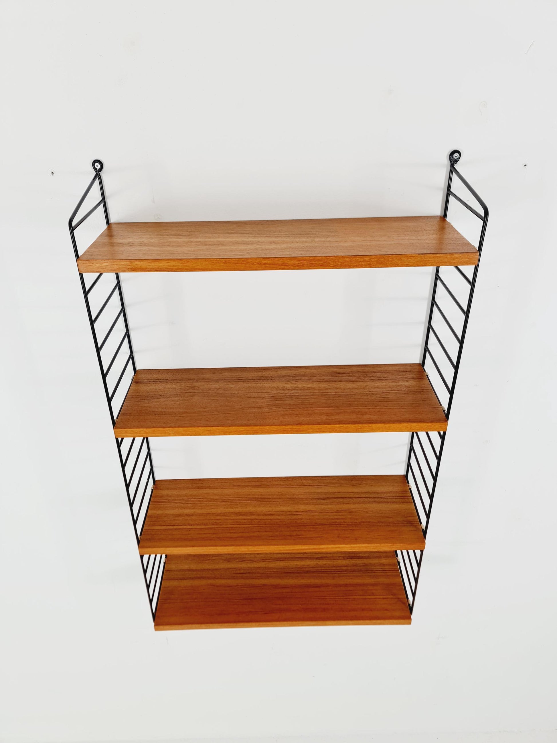 Original MCM Teak shelving system - consists of Black lacquered metal ladders, from string Stockholm 1960s