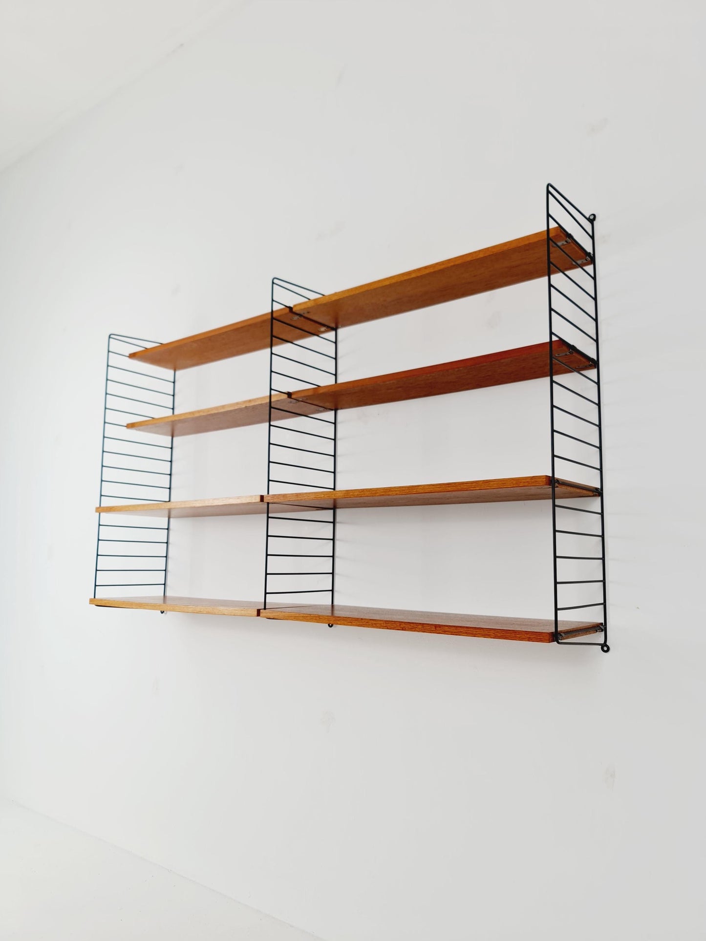 Original MCM Teak shelving system - consists of black lacquered metal ladders, from string Stockholm 1960s