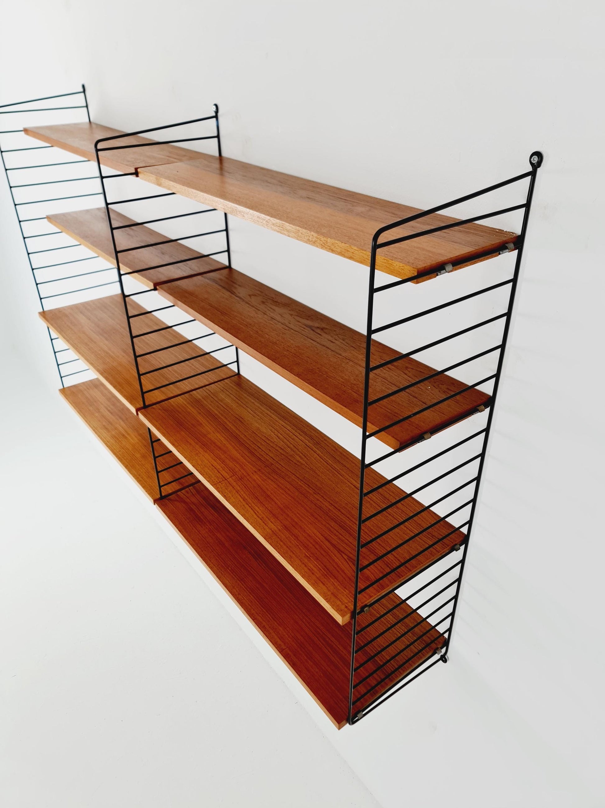 Original MCM Teak shelving system - consists of black lacquered metal ladders, from string Stockholm 1960s