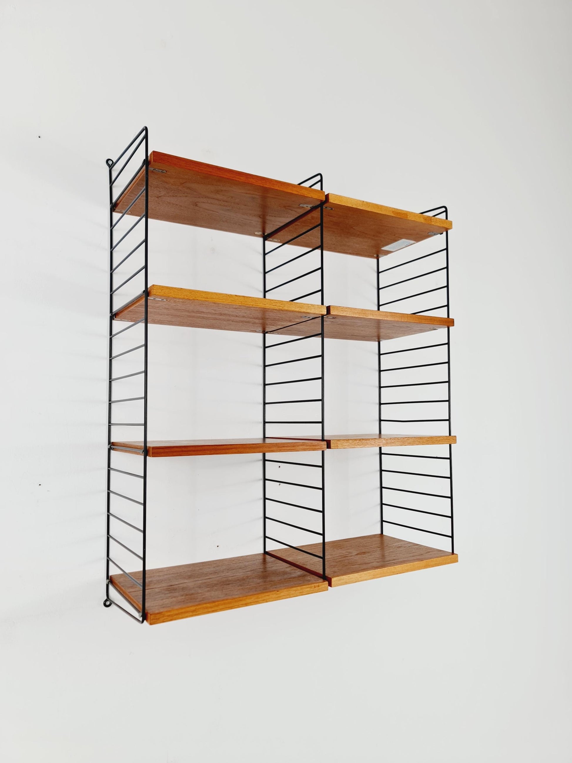 Original MCM Teak shelving system - consists of Black lacquered metal ladders, from string Stockholm 1960s