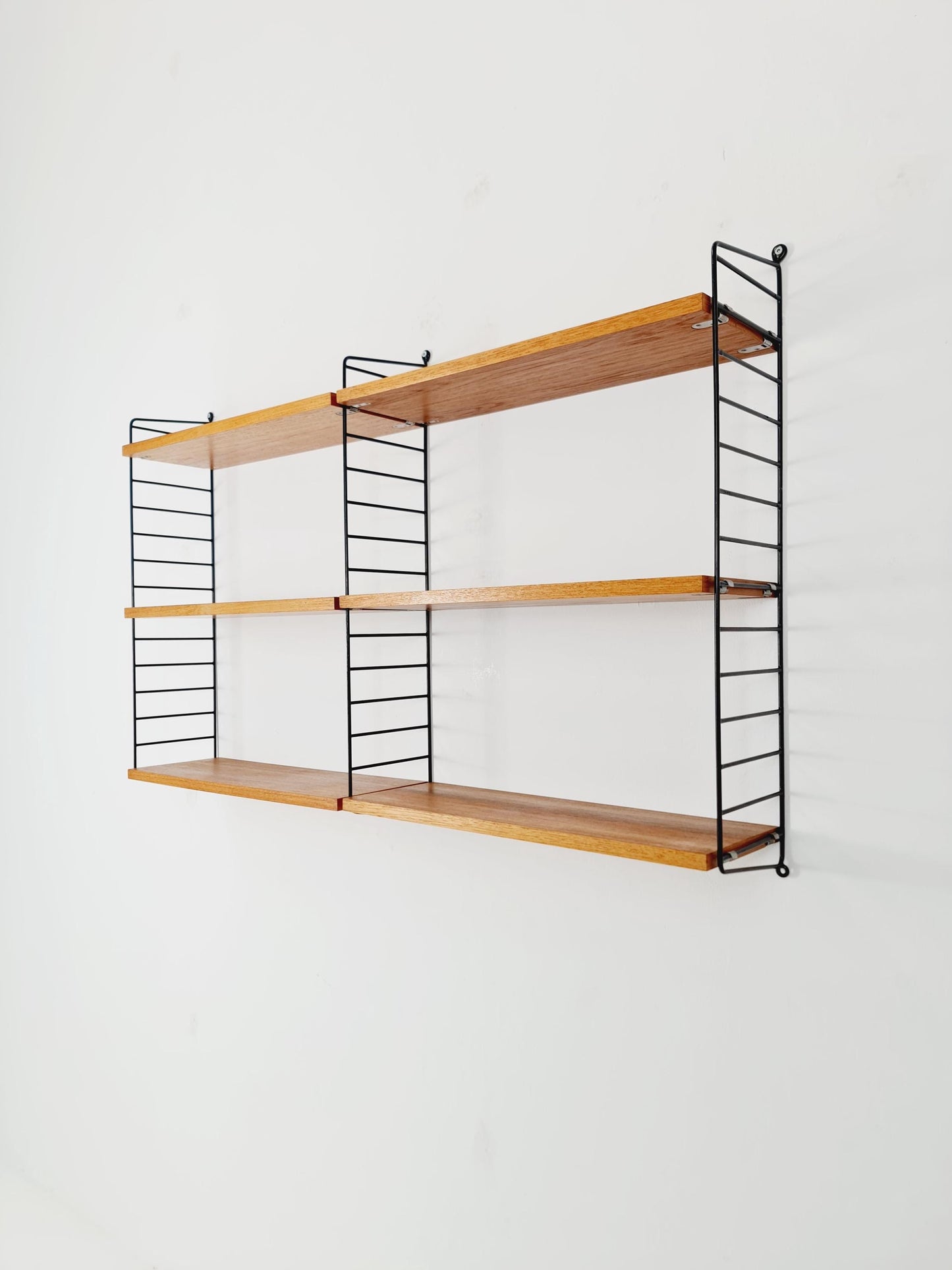 Original MCM Teak shelving system - consists of Black lacquered metal ladders, from string Stockholm 1960s