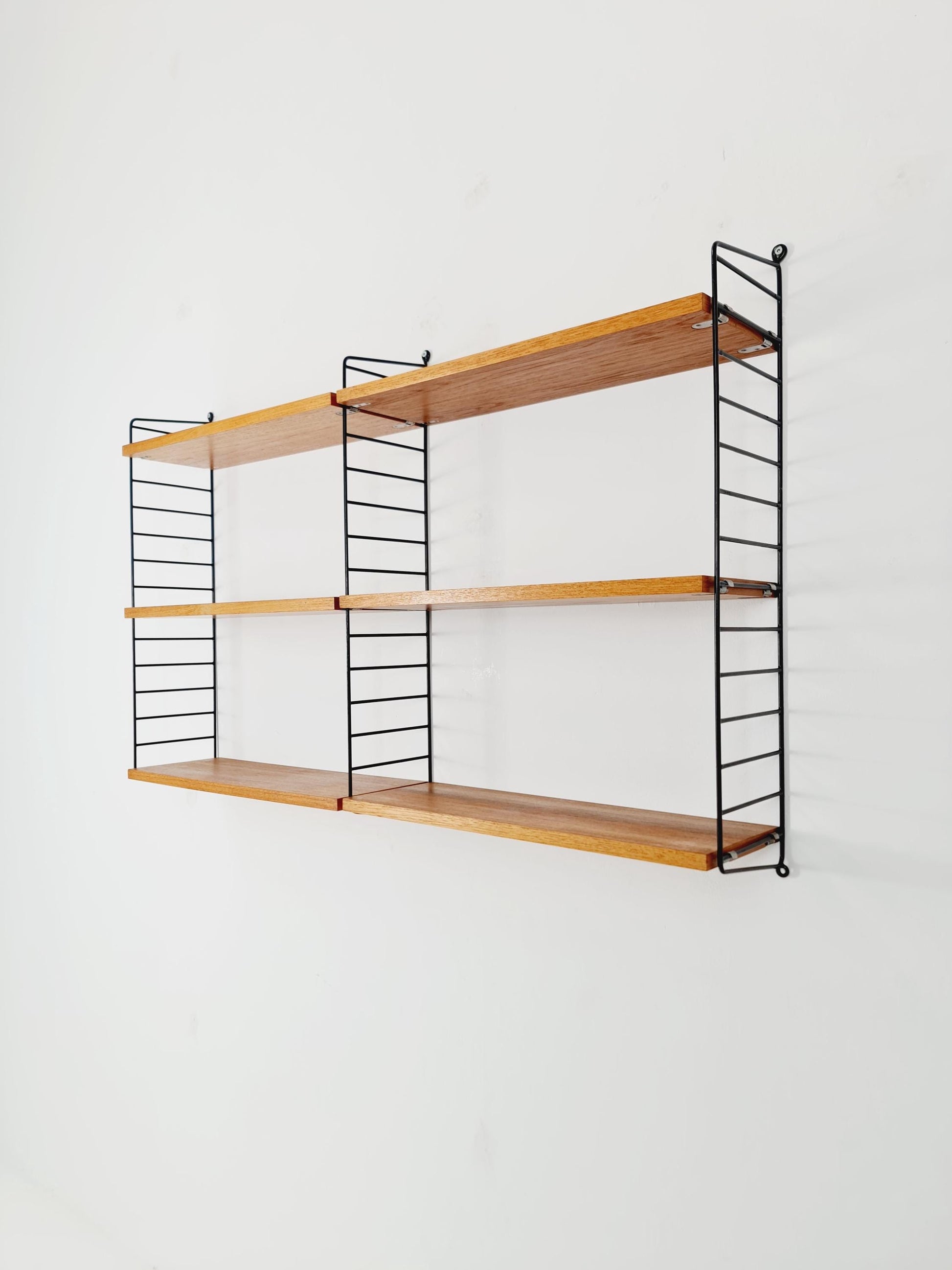 Original MCM Teak shelving system - consists of Black lacquered metal ladders, from string Stockholm 1960s
