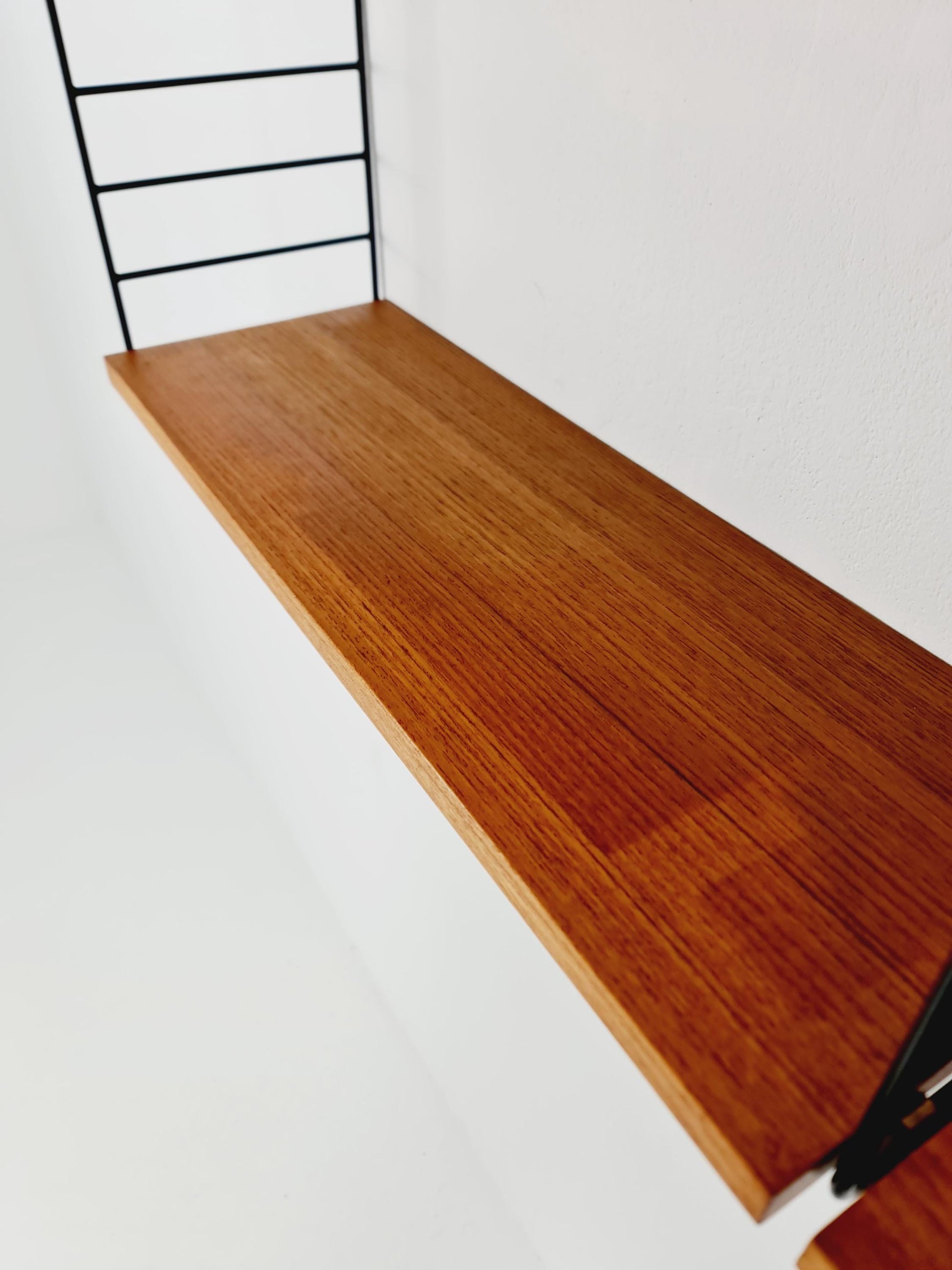 Original MCM Teak shelving system - consists of Black lacquered metal ladders, from string Stockholm 1960s