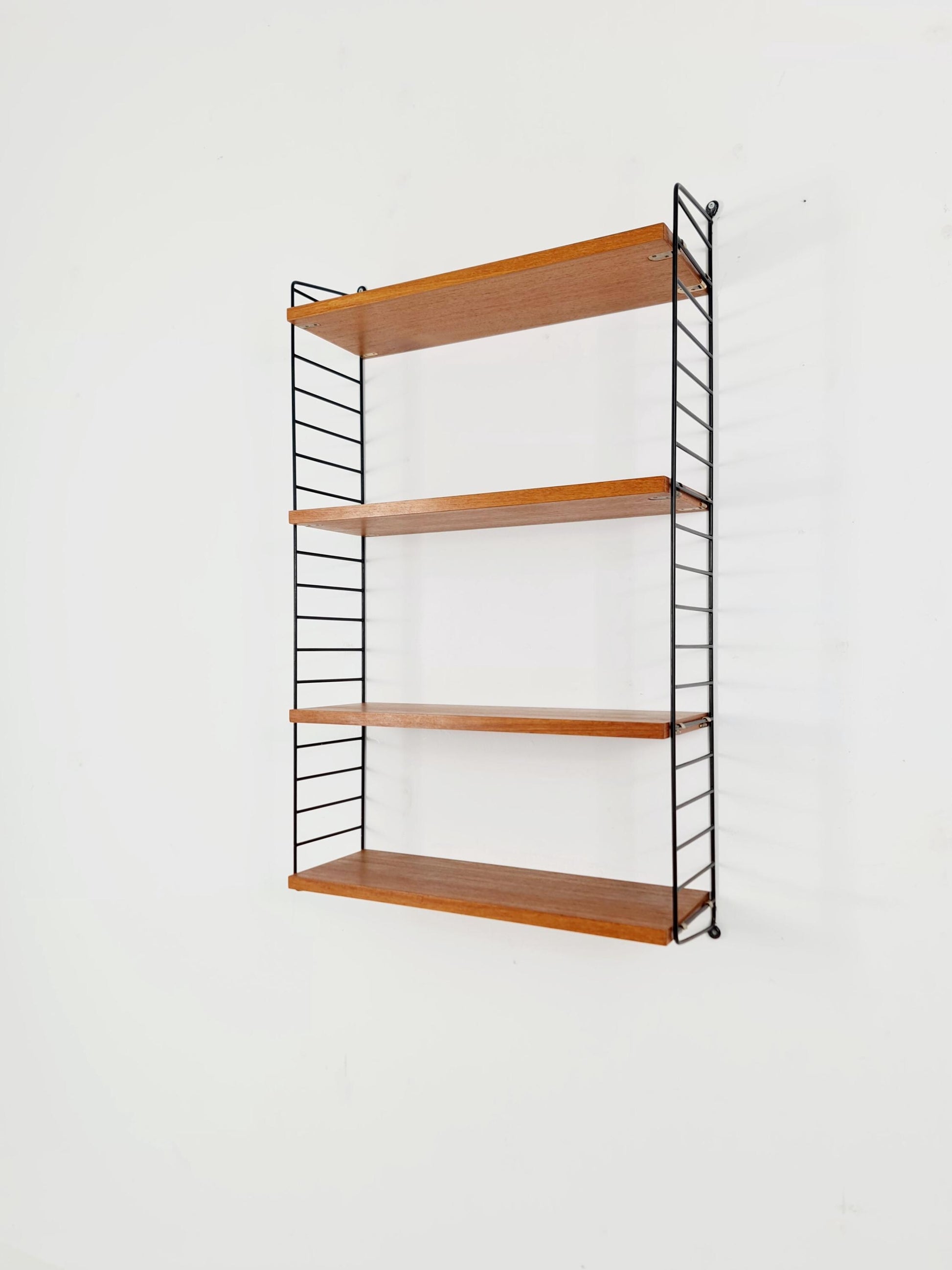 Original MCM Teak shelving system - consists of Black lacquered metal ladders, from string Stockholm 1960s
