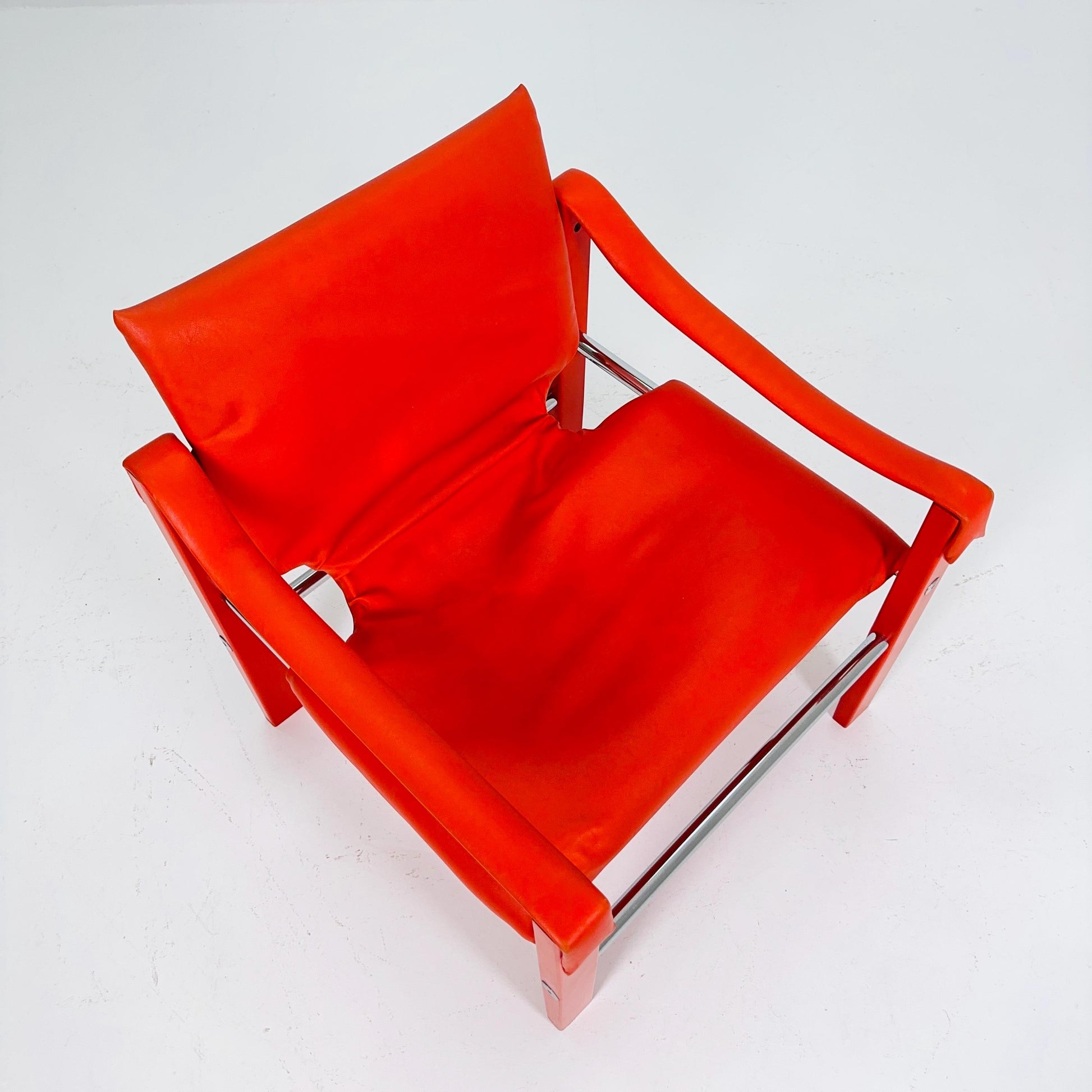 Mid century Red leather Safari armchairs from Arkana by Maurice Burke, United Kingdom 1970s Scotland