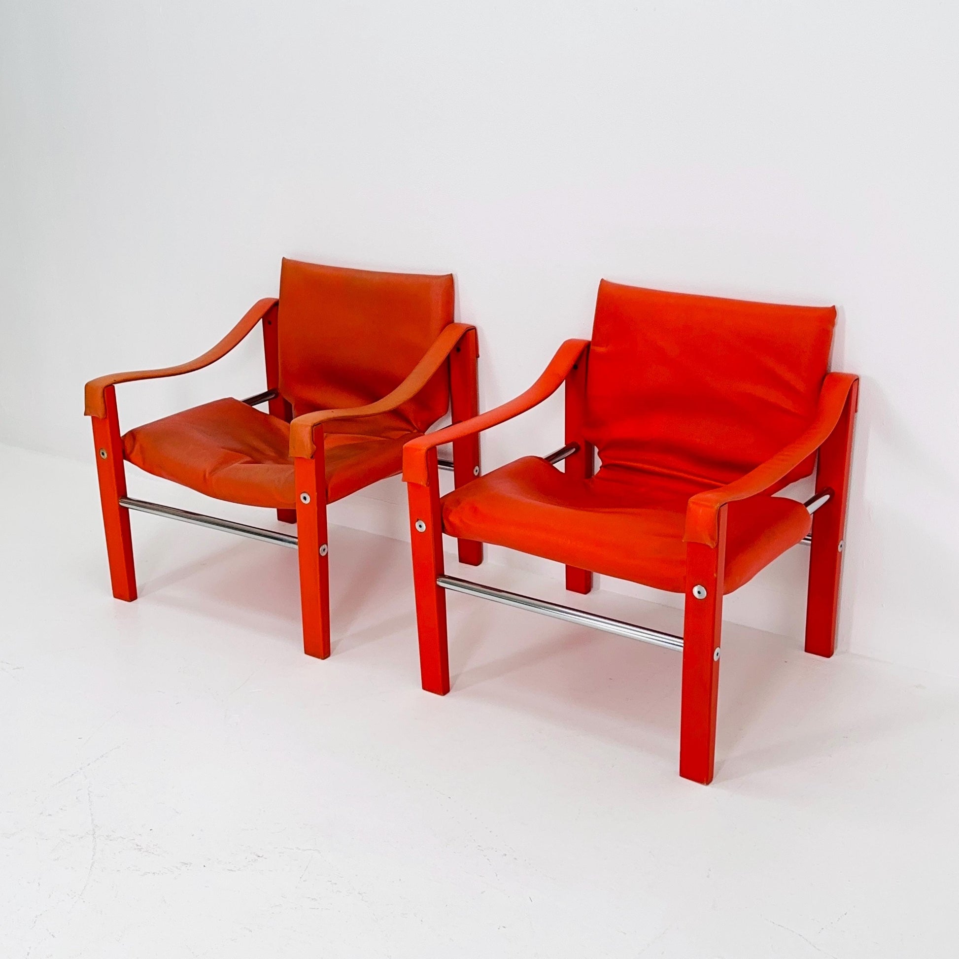 Set of 2 Mid century Red leather Safari armchairs from Arkana by Maurice Burke, United Kingdom 1970s Scotland