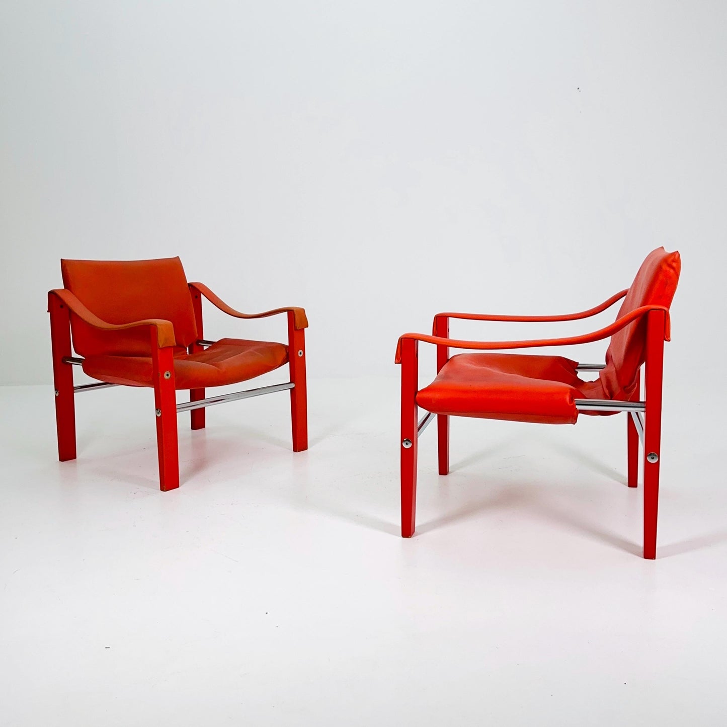 Set of 2 Mid century Red leather Safari armchairs from Arkana by Maurice Burke, United Kingdom 1970s Scotland