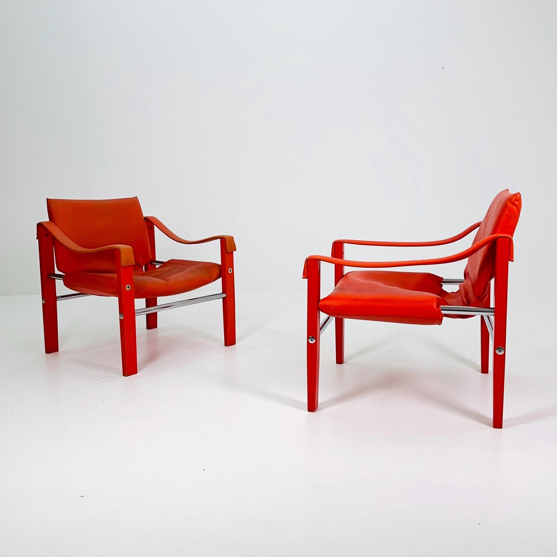 Set of 2 Mid century Red leather Safari armchairs from Arkana by Maurice Burke, United Kingdom 1970s Scotland