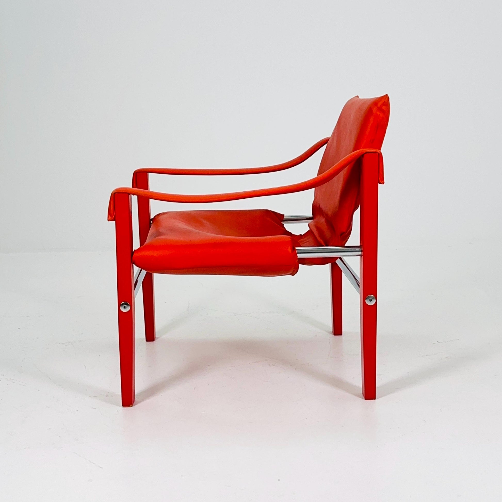 Set of 2 Mid century Red leather Safari armchairs from Arkana by Maurice Burke, United Kingdom 1970s Scotland
