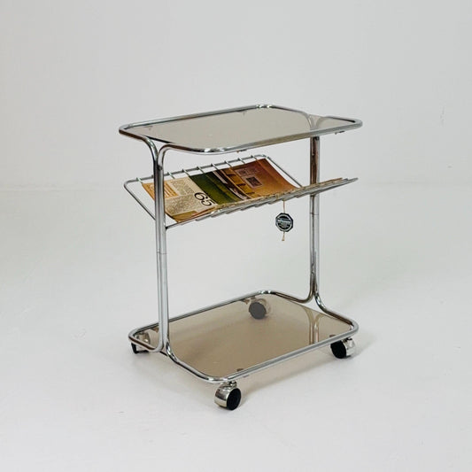 Mid century Chrome bar cart/serving trolley. magazine rack Smoked glass ,Bauhaus Germany 1980s