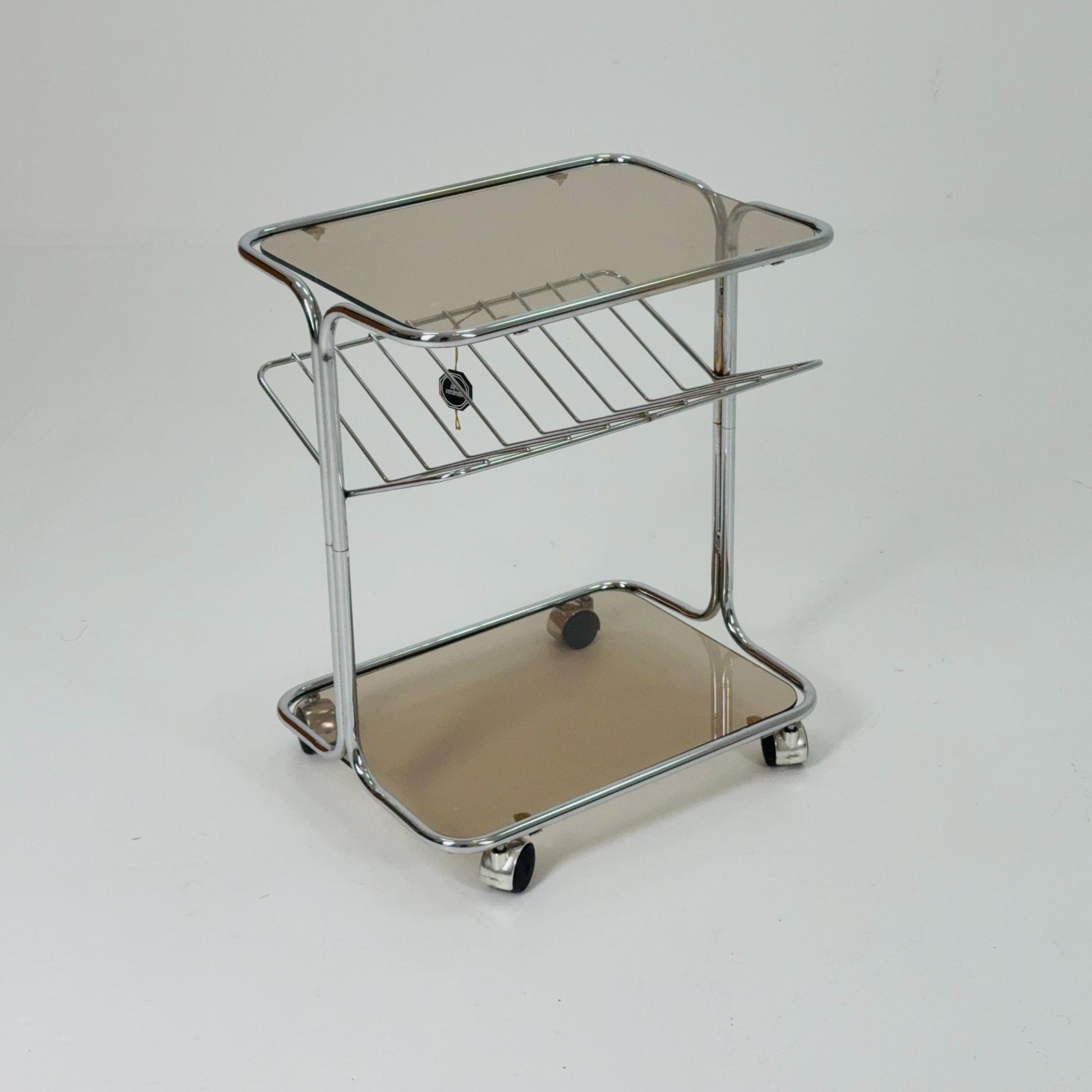 Mid century Chrome bar cart/serving trolley. magazine rack Smoked glass ,Bauhaus Germany 1980s