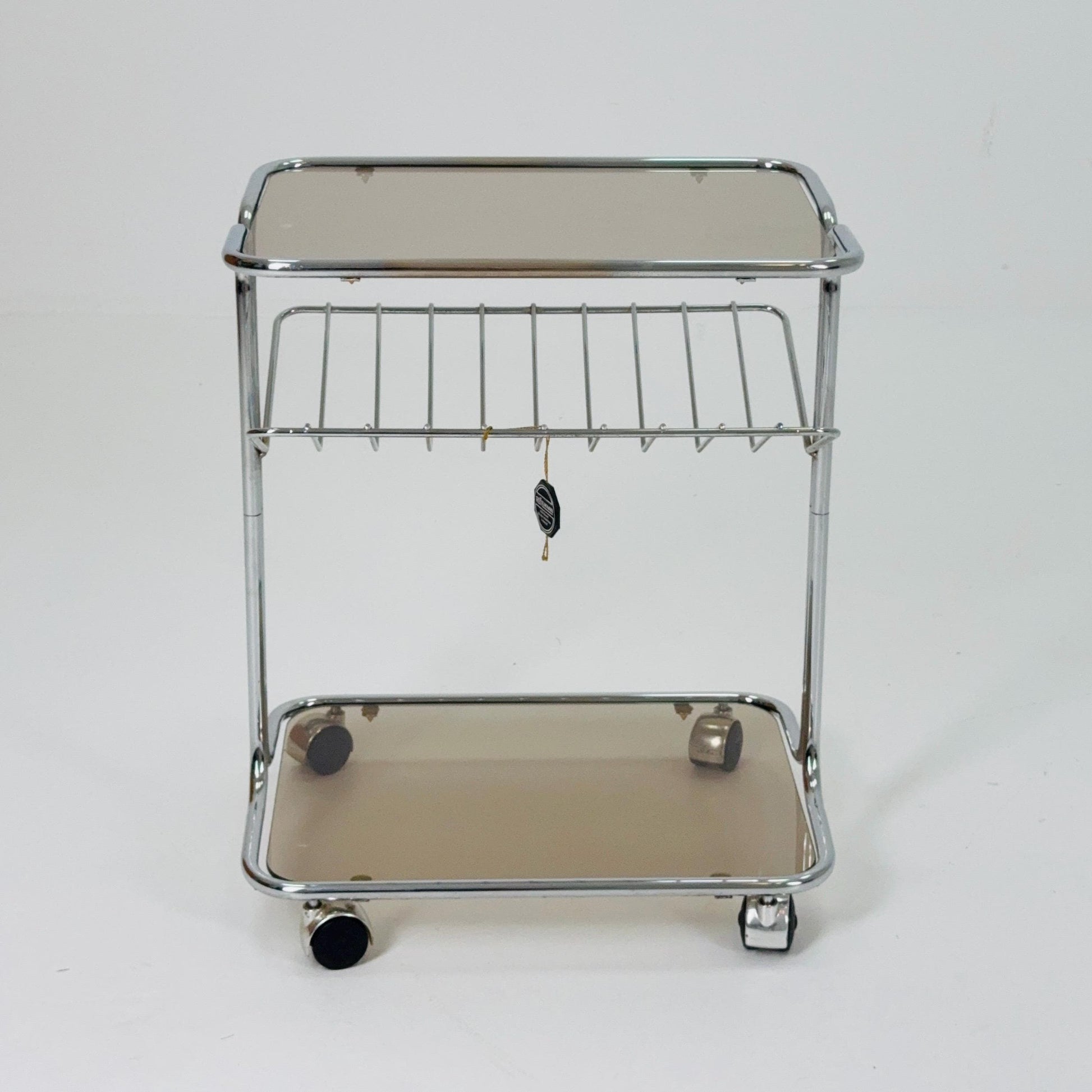 Mid century Chrome bar cart/serving trolley. magazine rack Smoked glass ,Bauhaus Germany 1980s