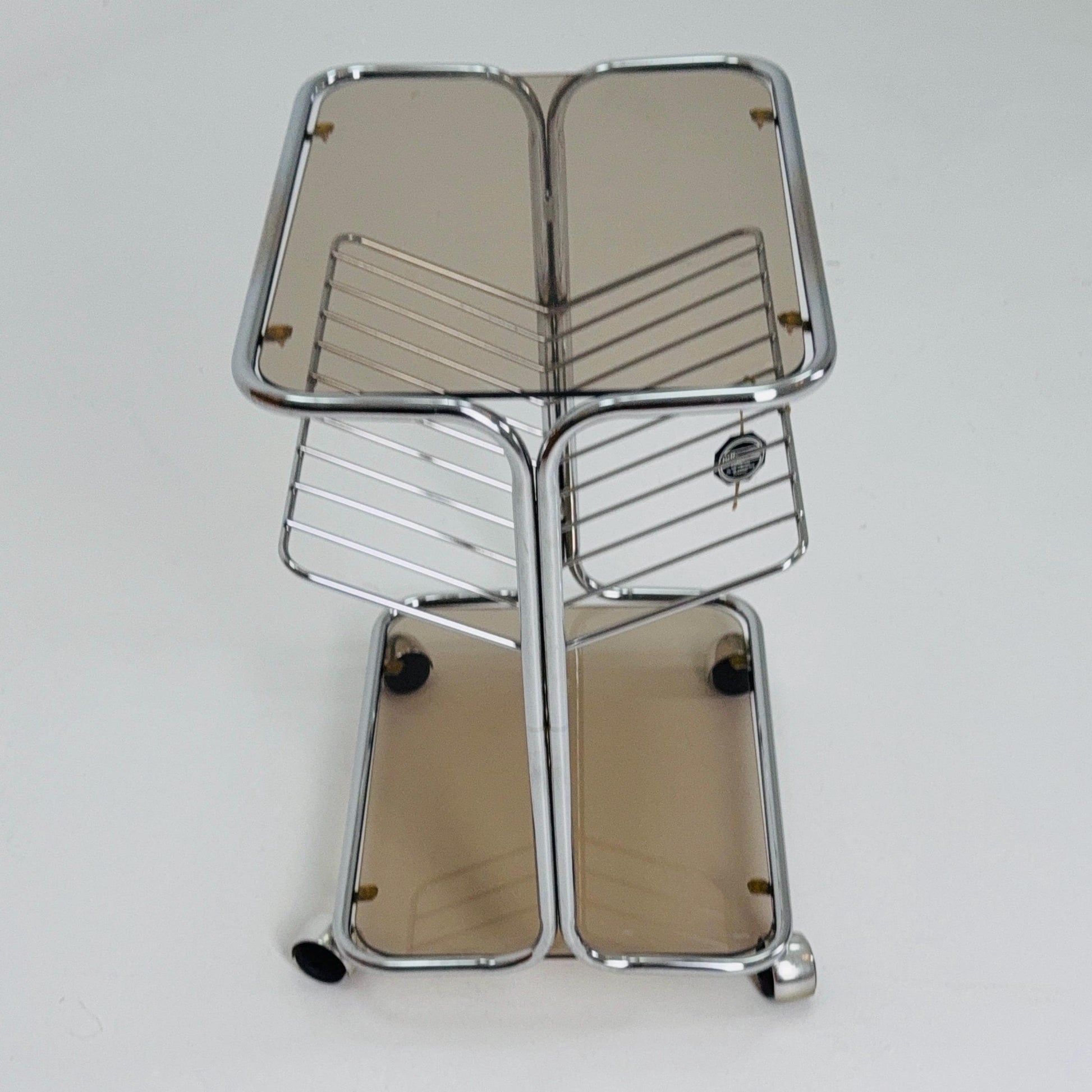 Mid century Chrome bar cart/serving trolley. magazine rack Smoked glass ,Bauhaus Germany 1980s